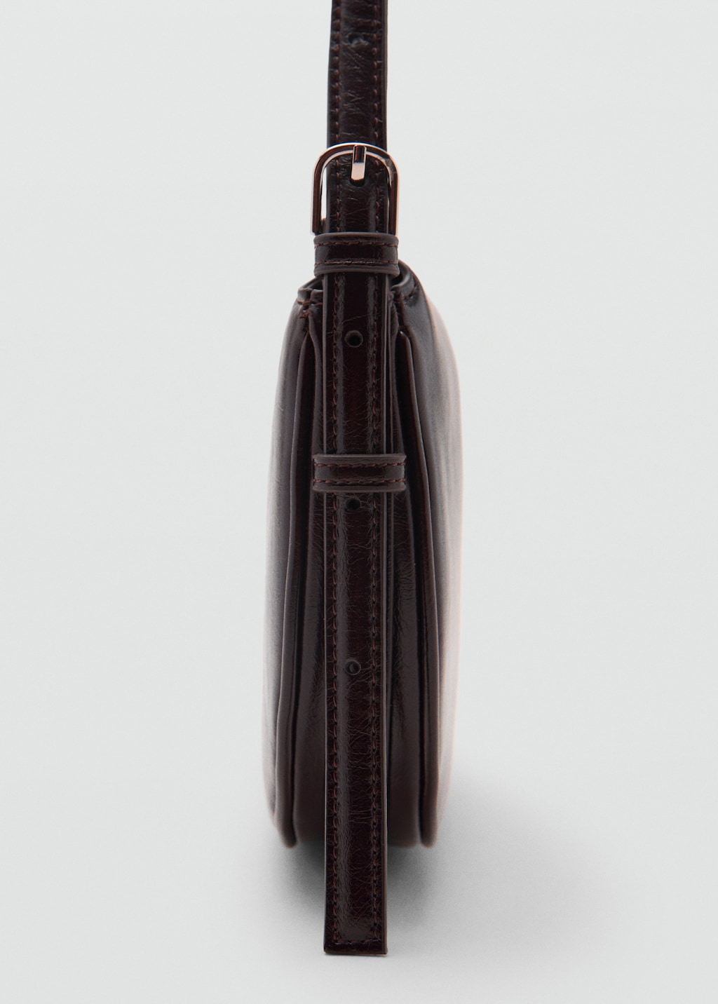 Oval shoulder bag with flap