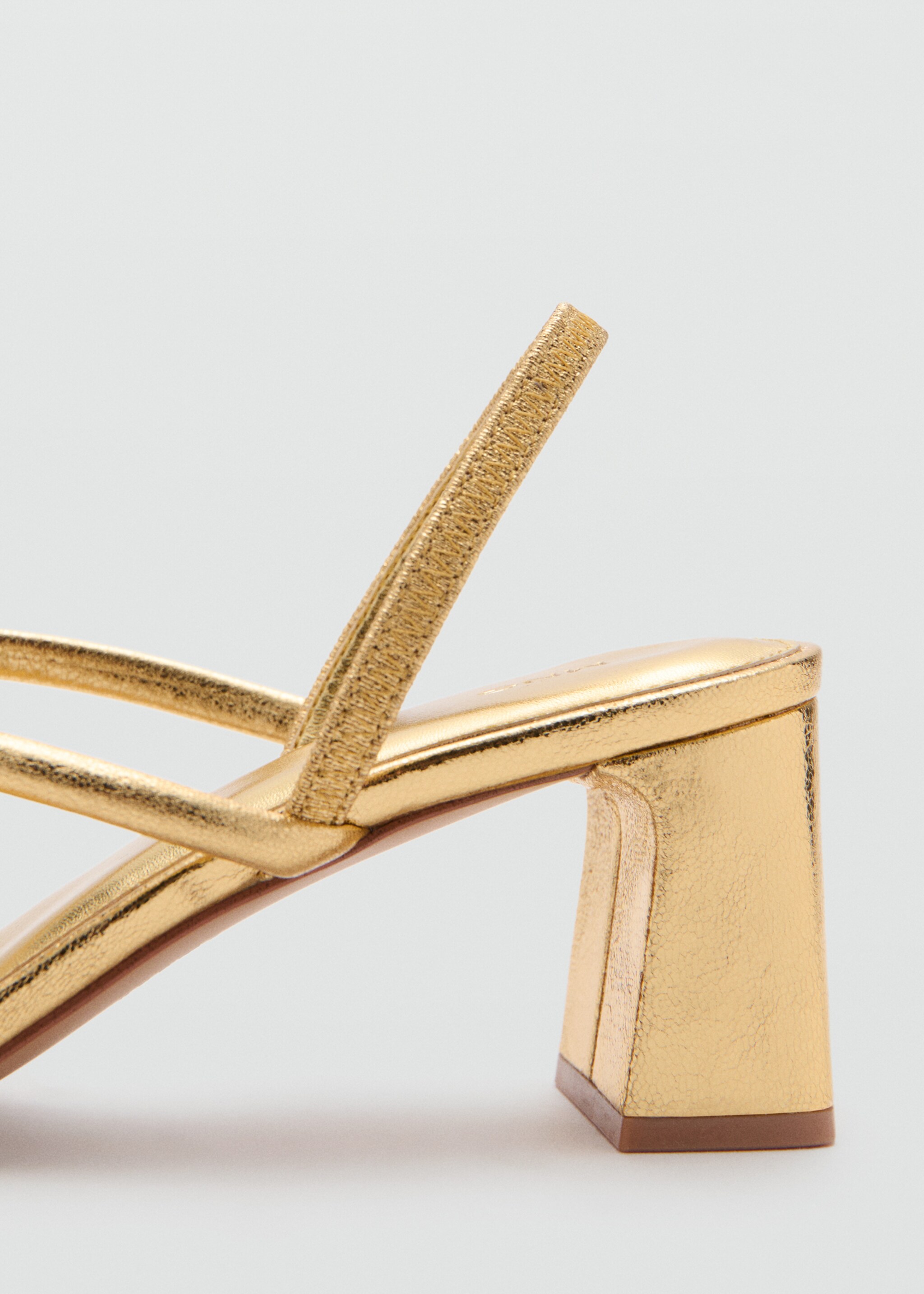 Metallic cross-strap sandal - Details of the article 1, Gold. Ref: 27035156-00.