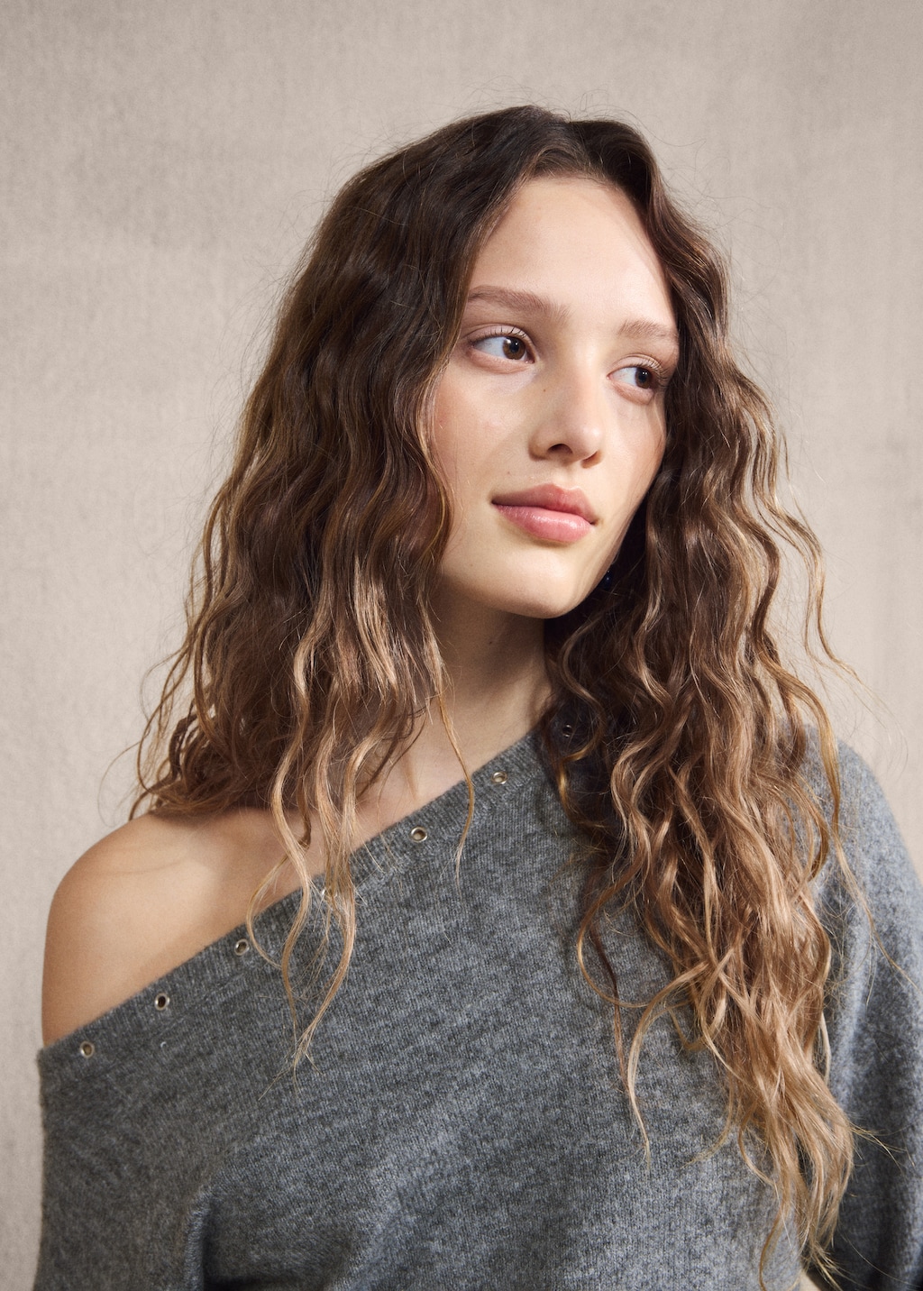 Asymmetrical studded sweater