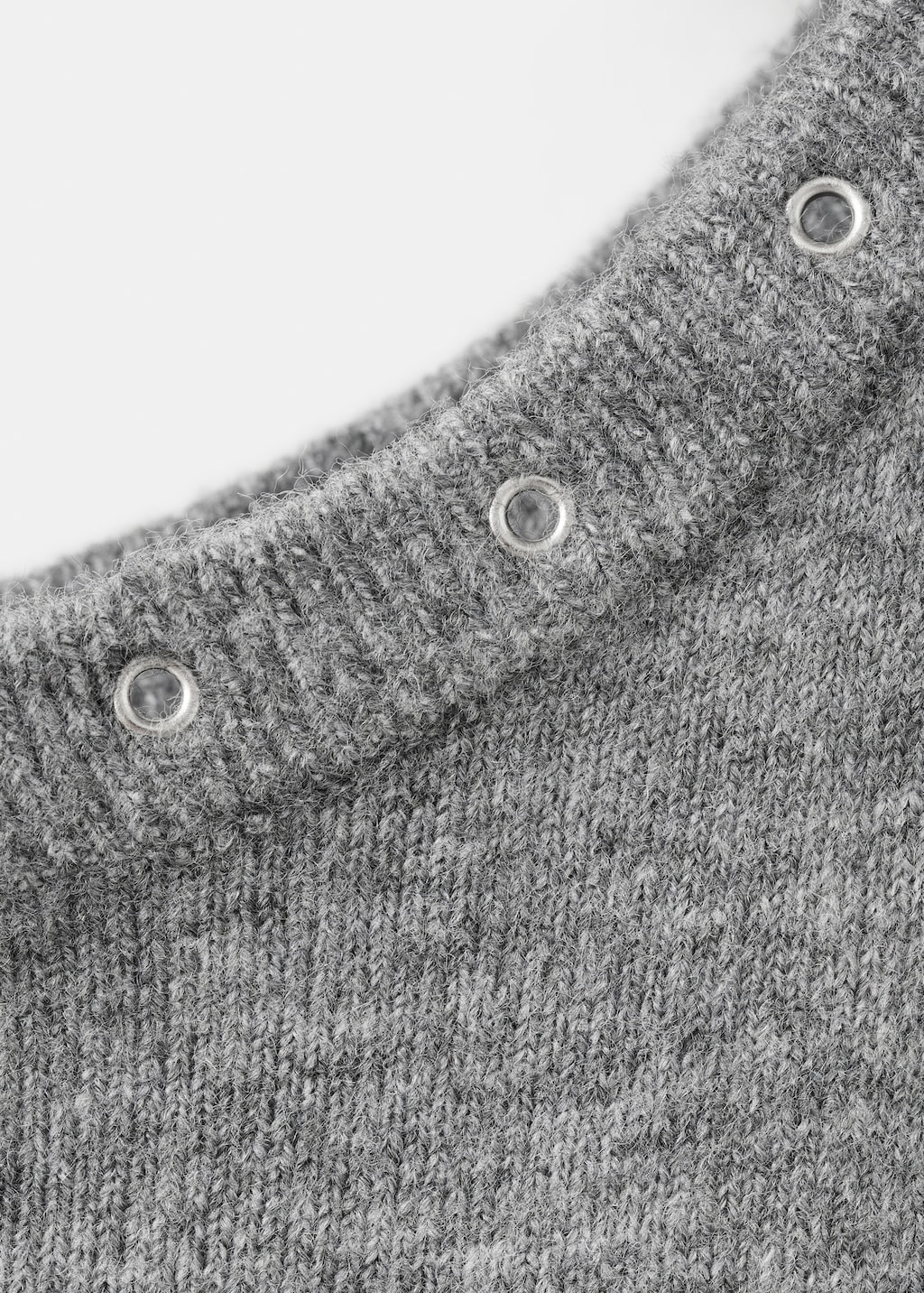 Asymmetrical studded sweater