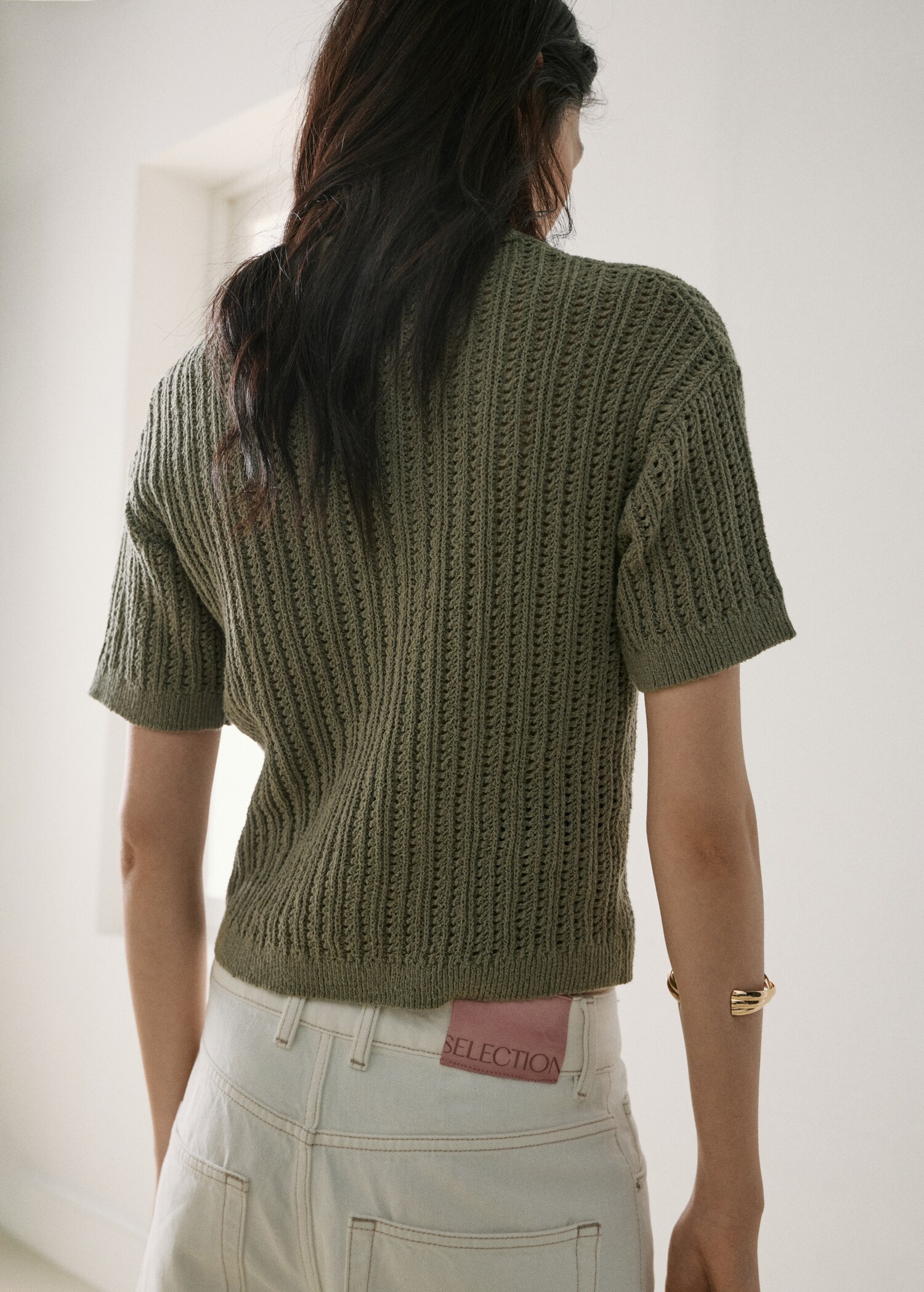 Openwork knitted polo-neck sweater - Reverse of the article