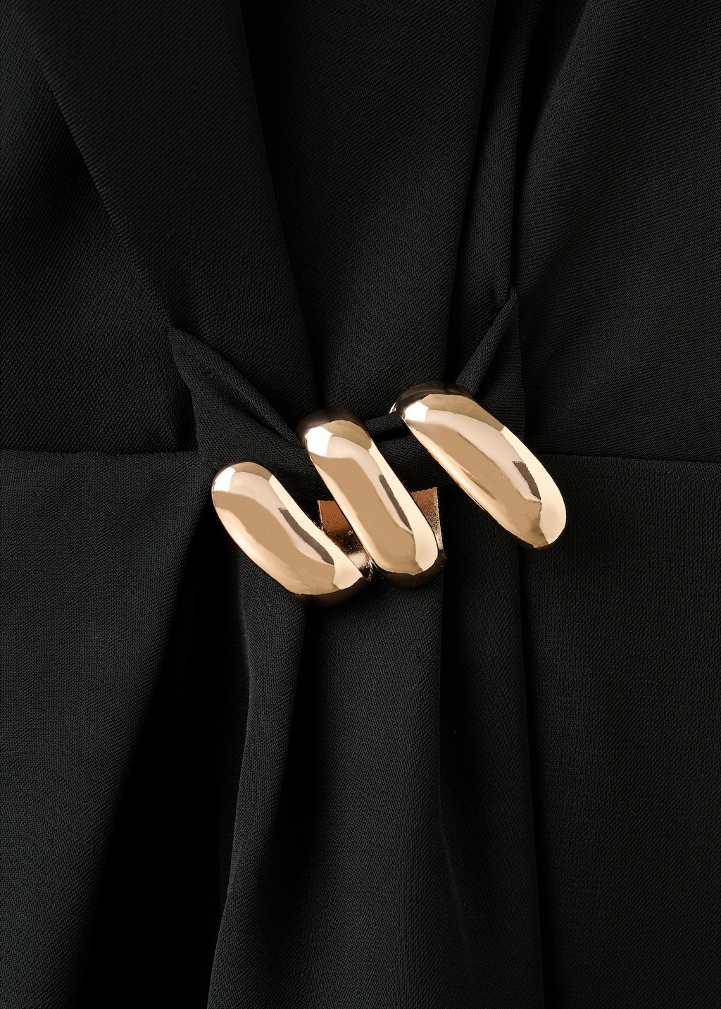 Dress with metal embellishment and cut-out