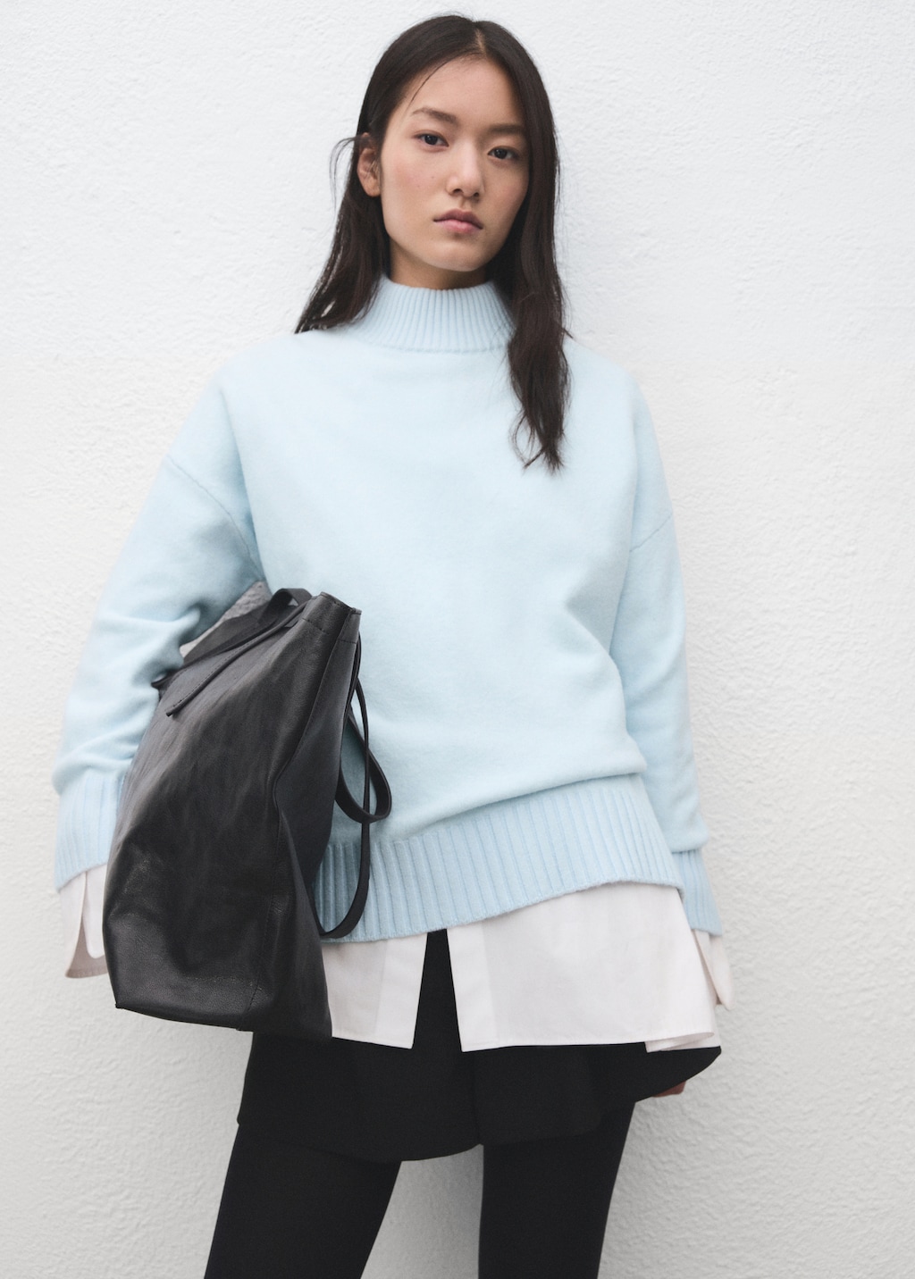 Knitted sweater with openings