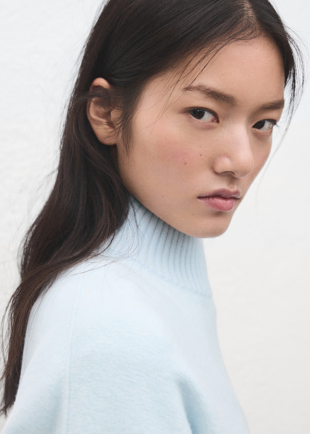 Knitted sweater with openings