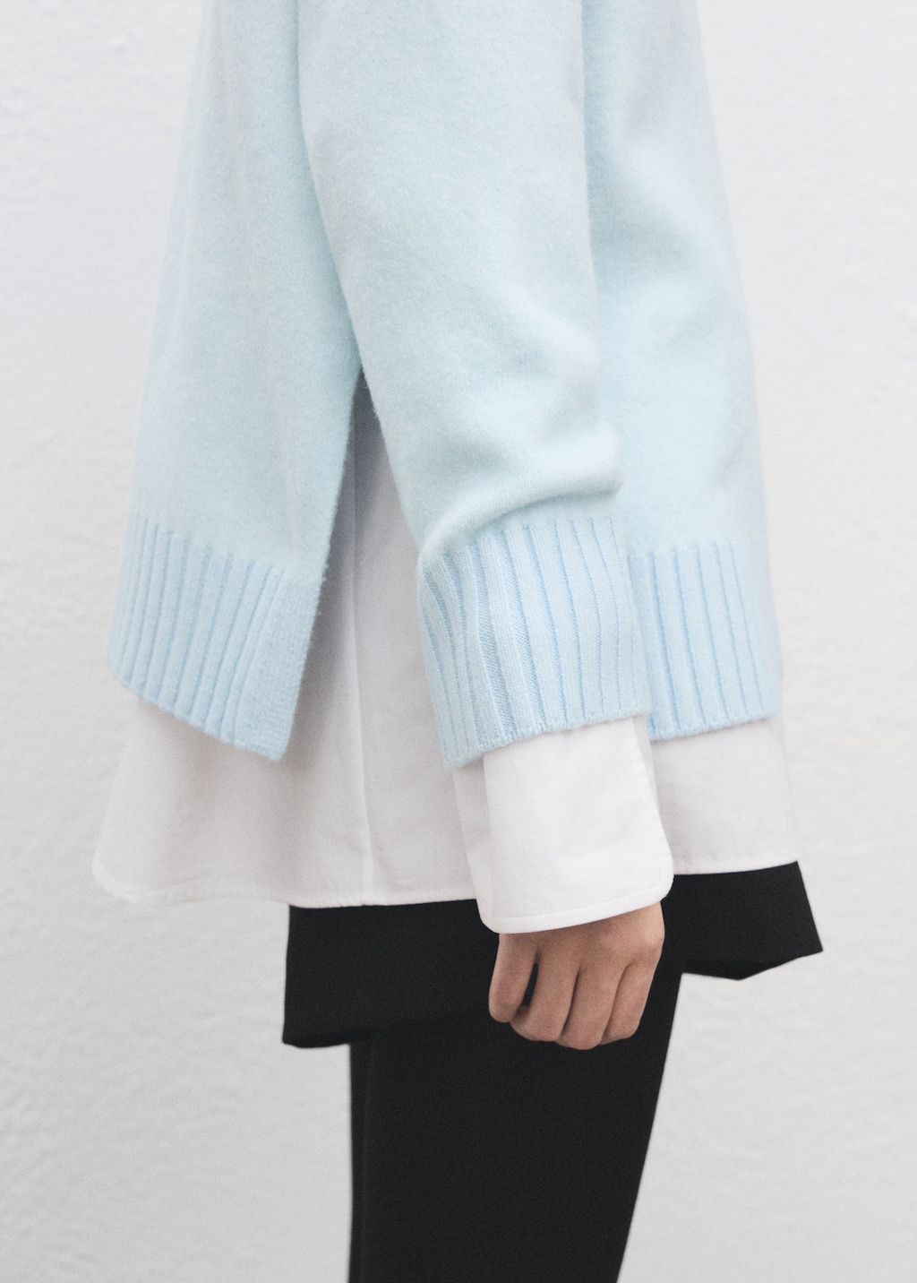 Knitted sweater with openings