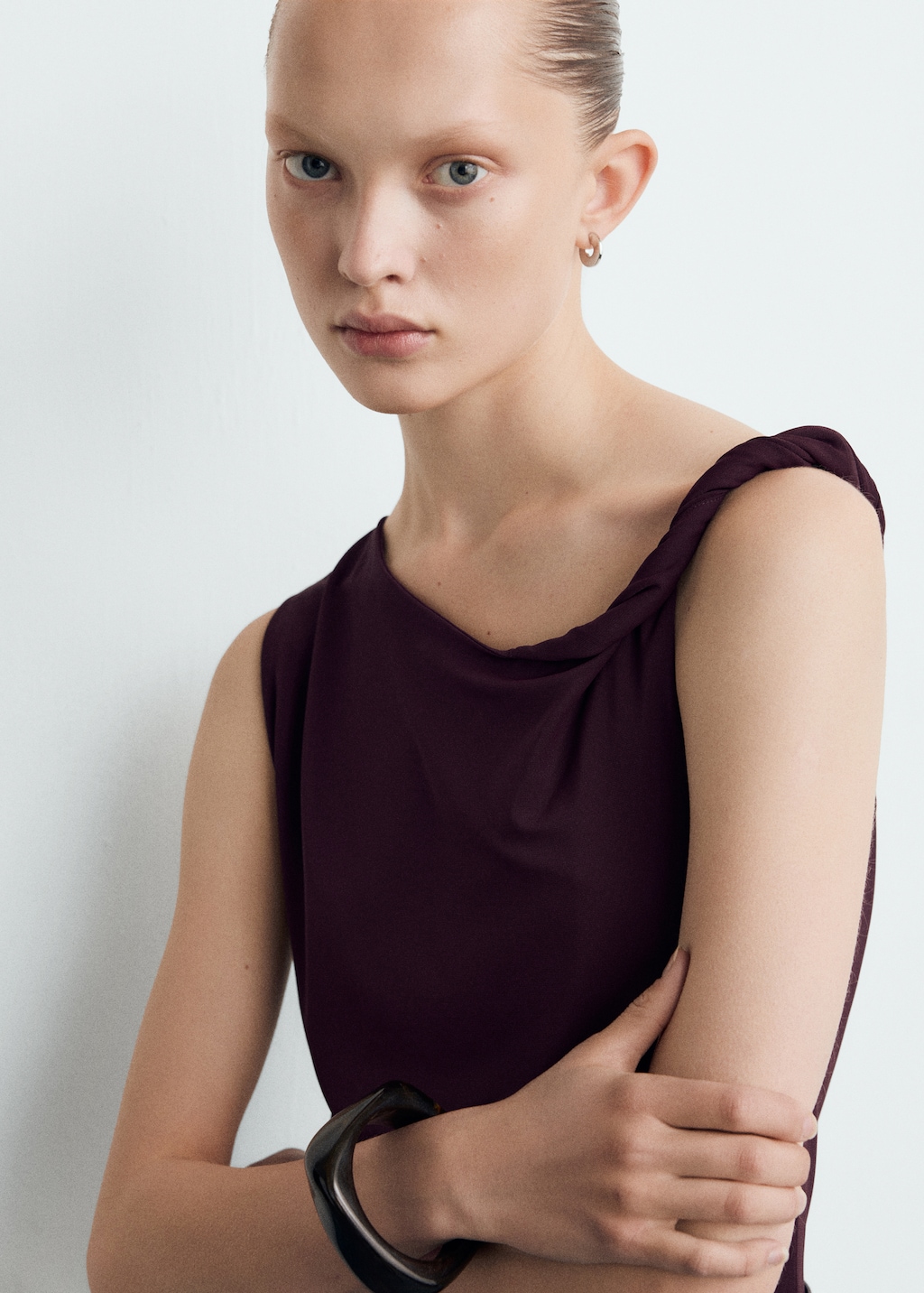 Jumpsuit with asymmetrical neckline and belt