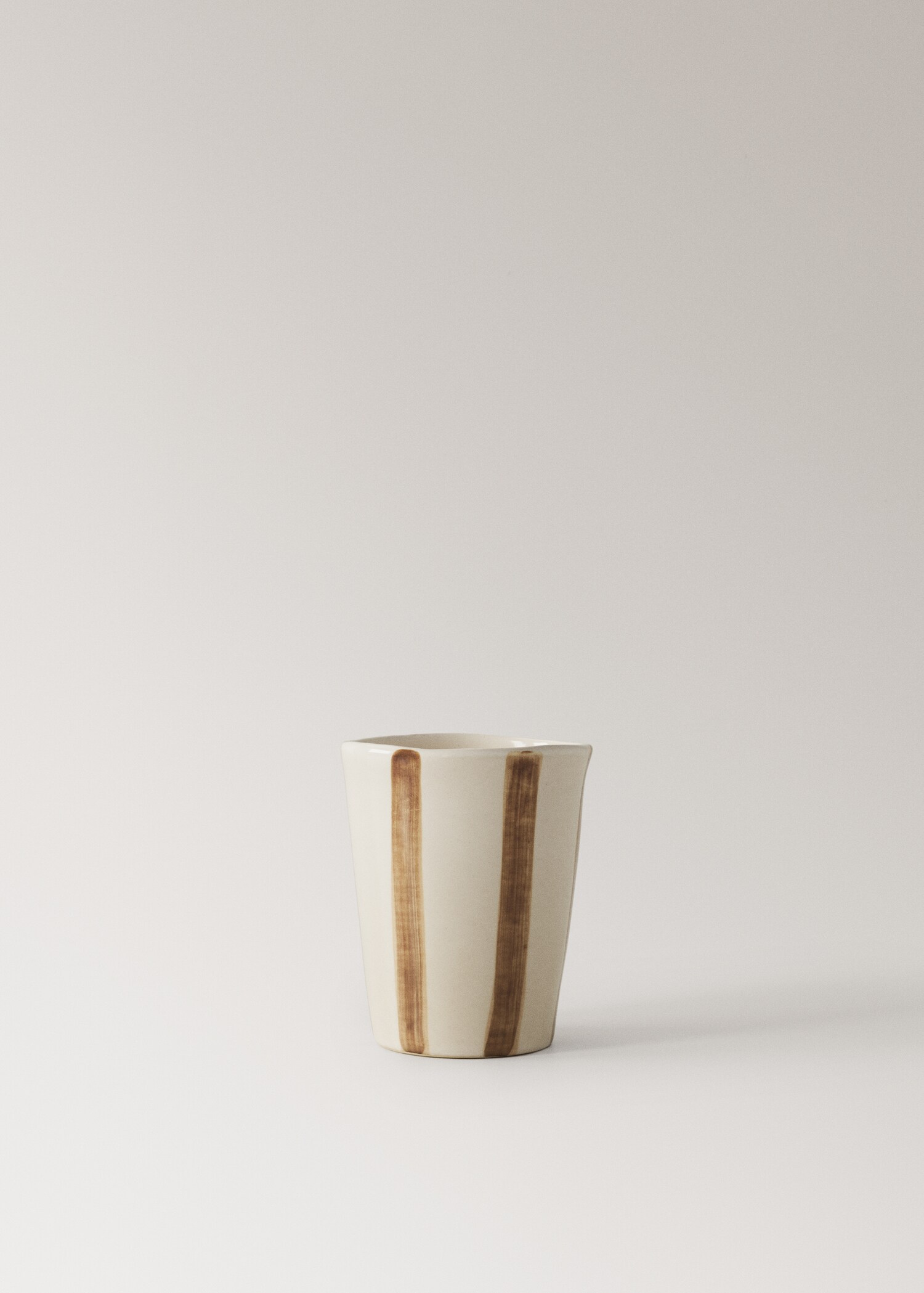 Striped stoneware coffee cup - Article without model