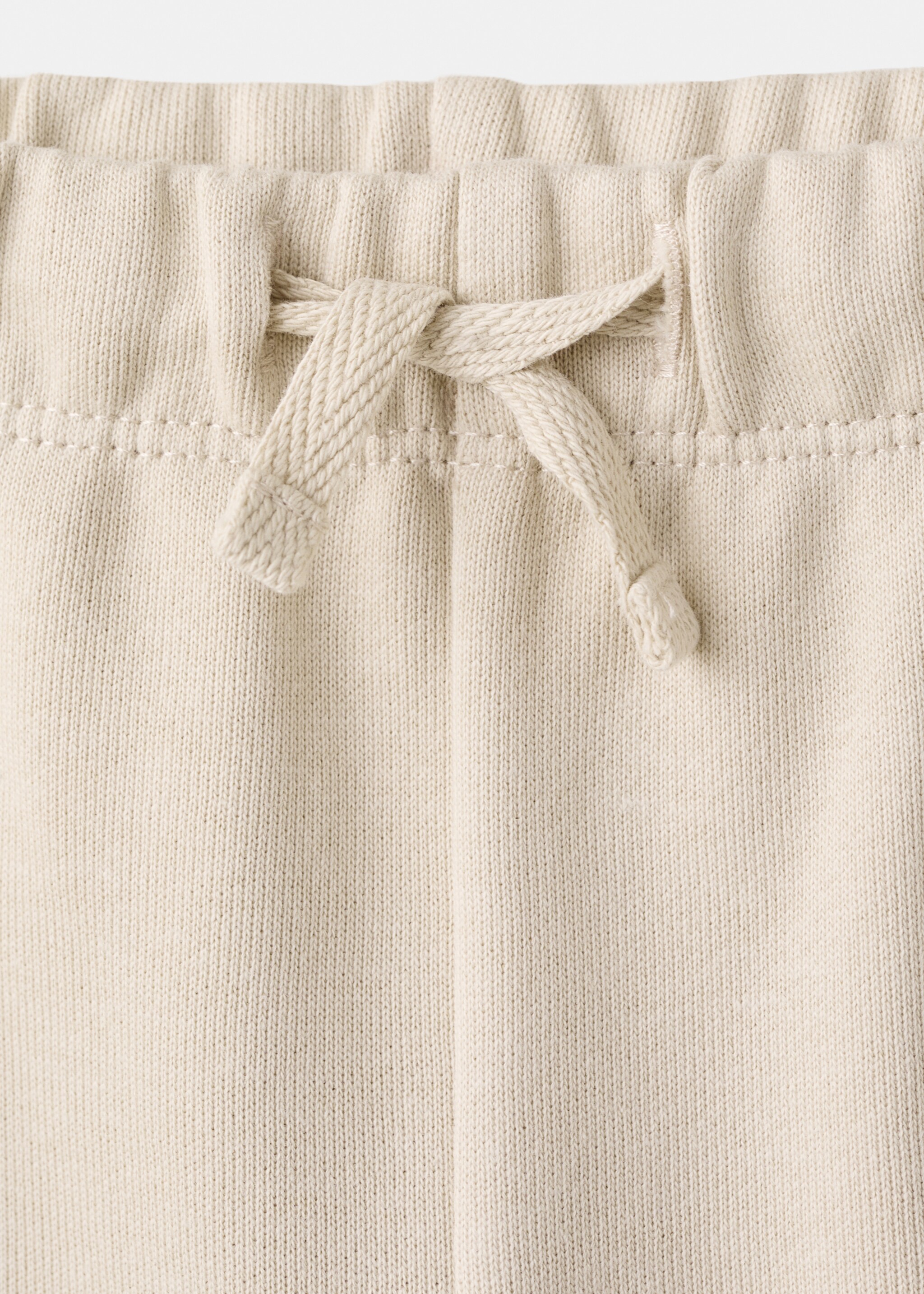 Cotton joggers embroidered detail - Details of the article 8, Beige. Ref: 27063713-00.