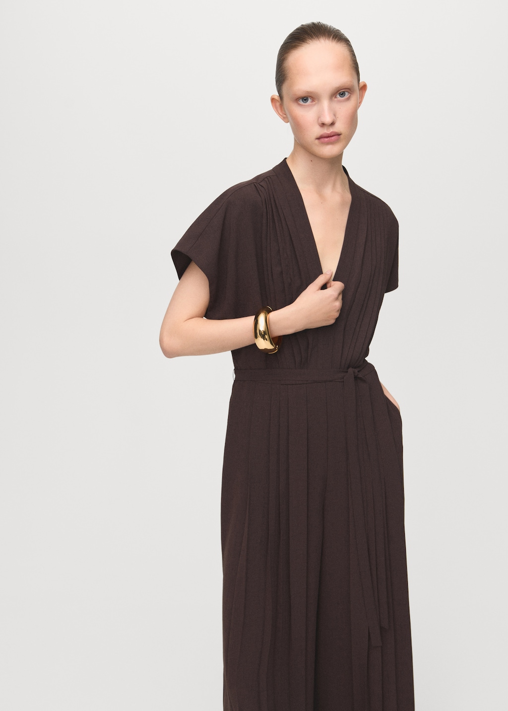 Pleated jumpsuit with belt