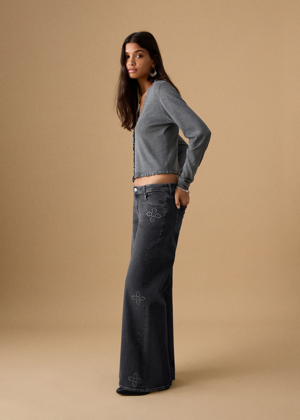 Low-waist studded jeans