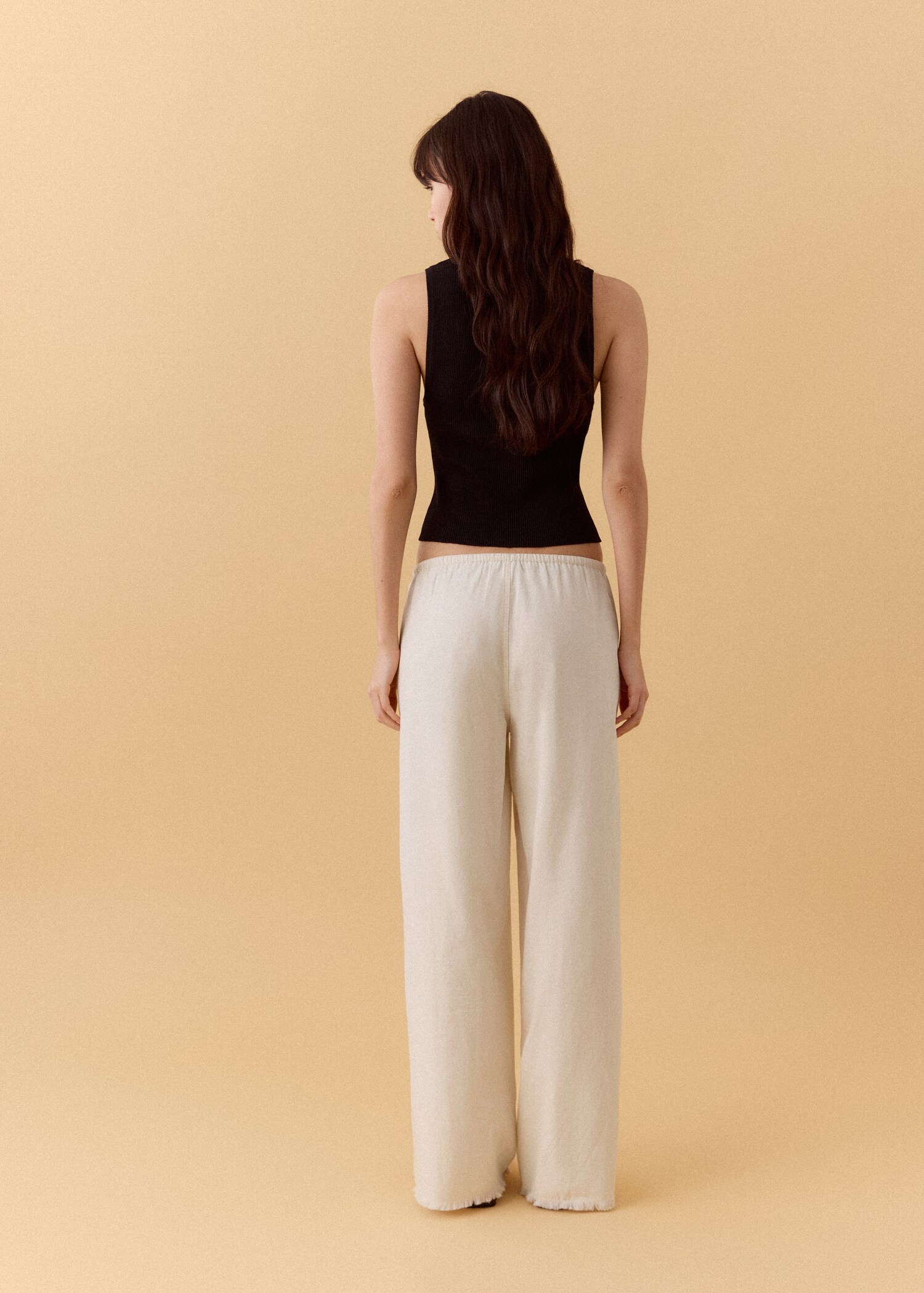 Fluid trousers with studs - Reverse of the article