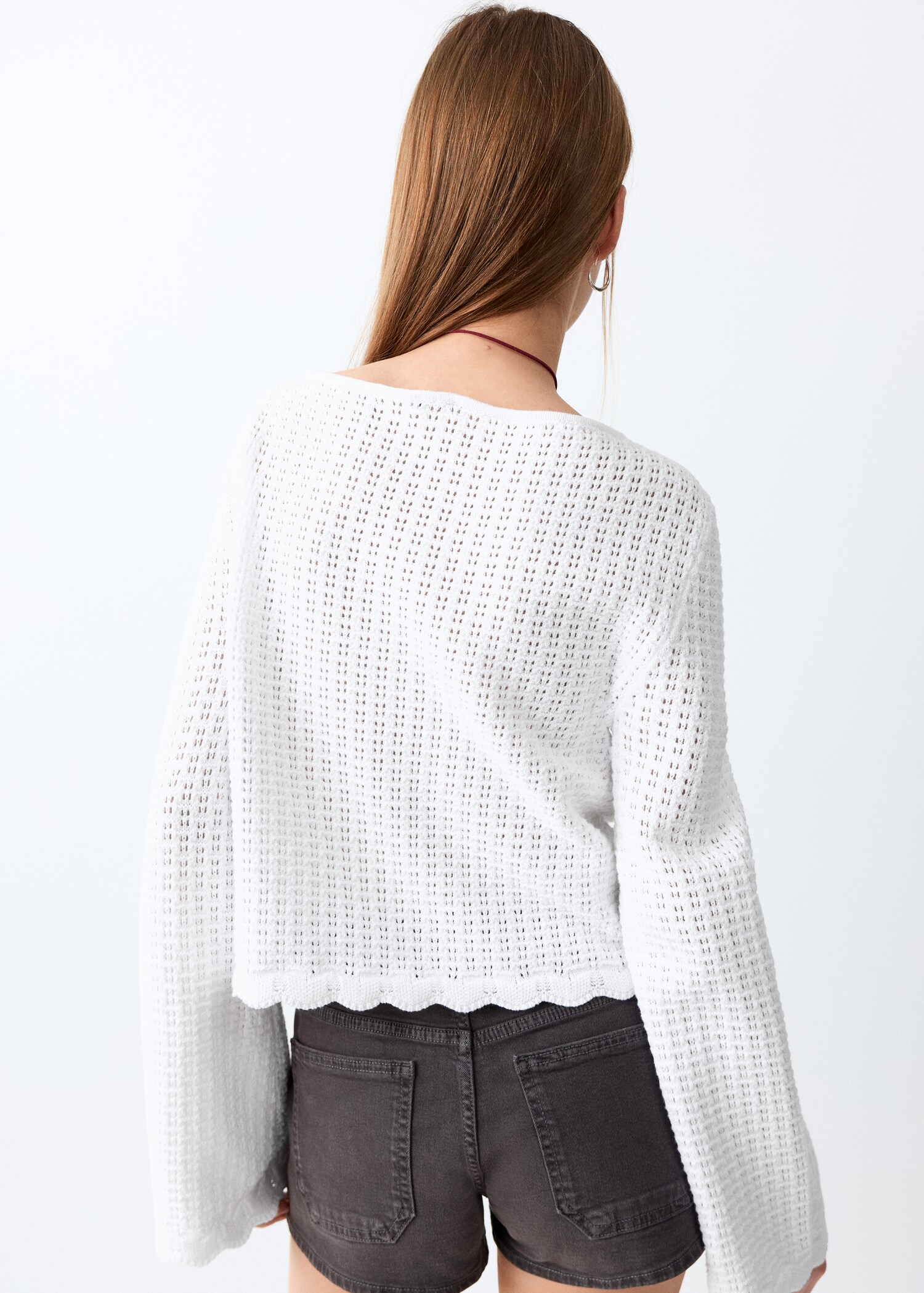 Knitted ribbed sweater - Reverse of the article