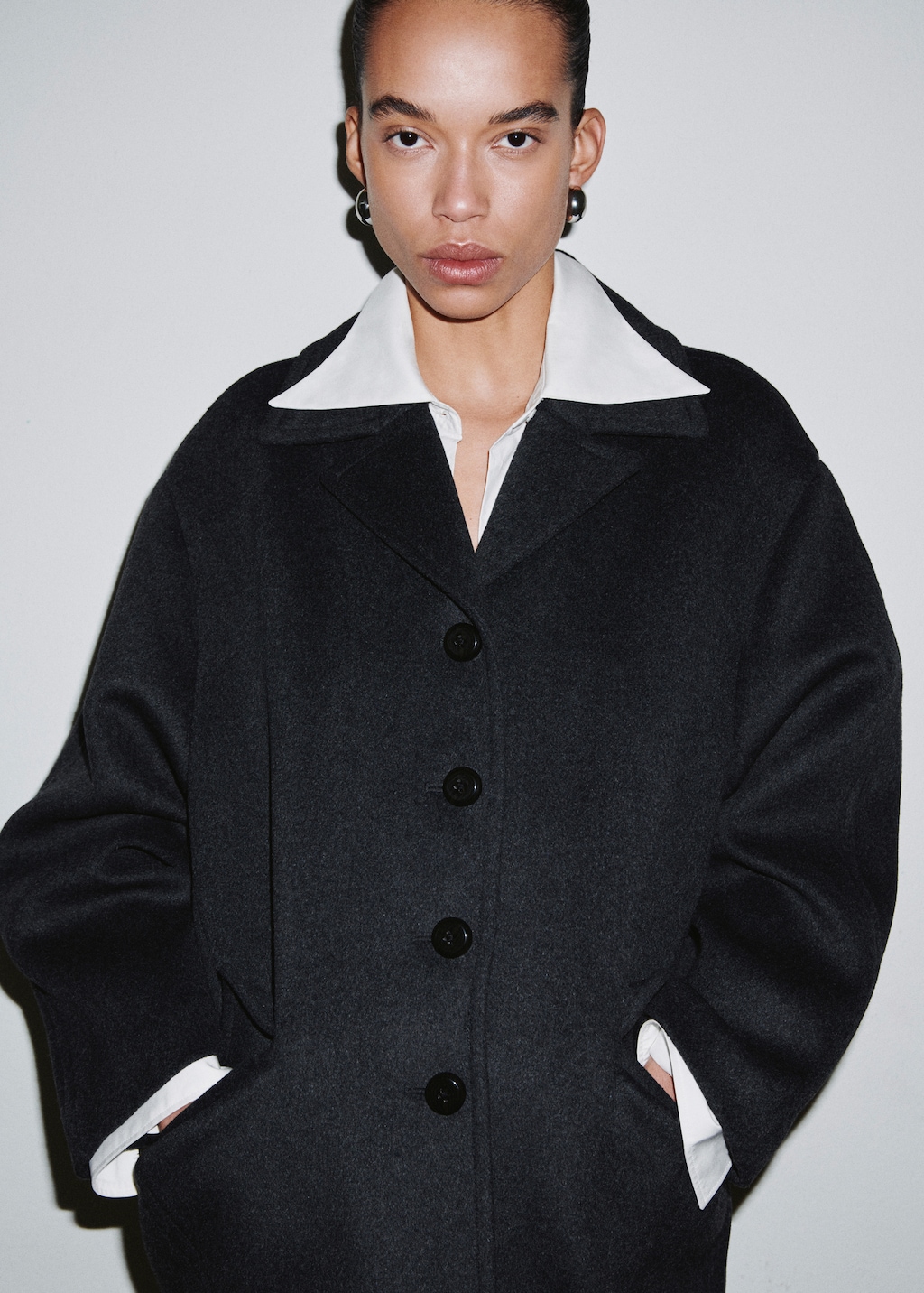 Wool-blend coat with button fastening