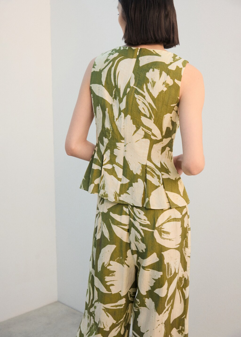 Peplum top with pleated panels - image 3
