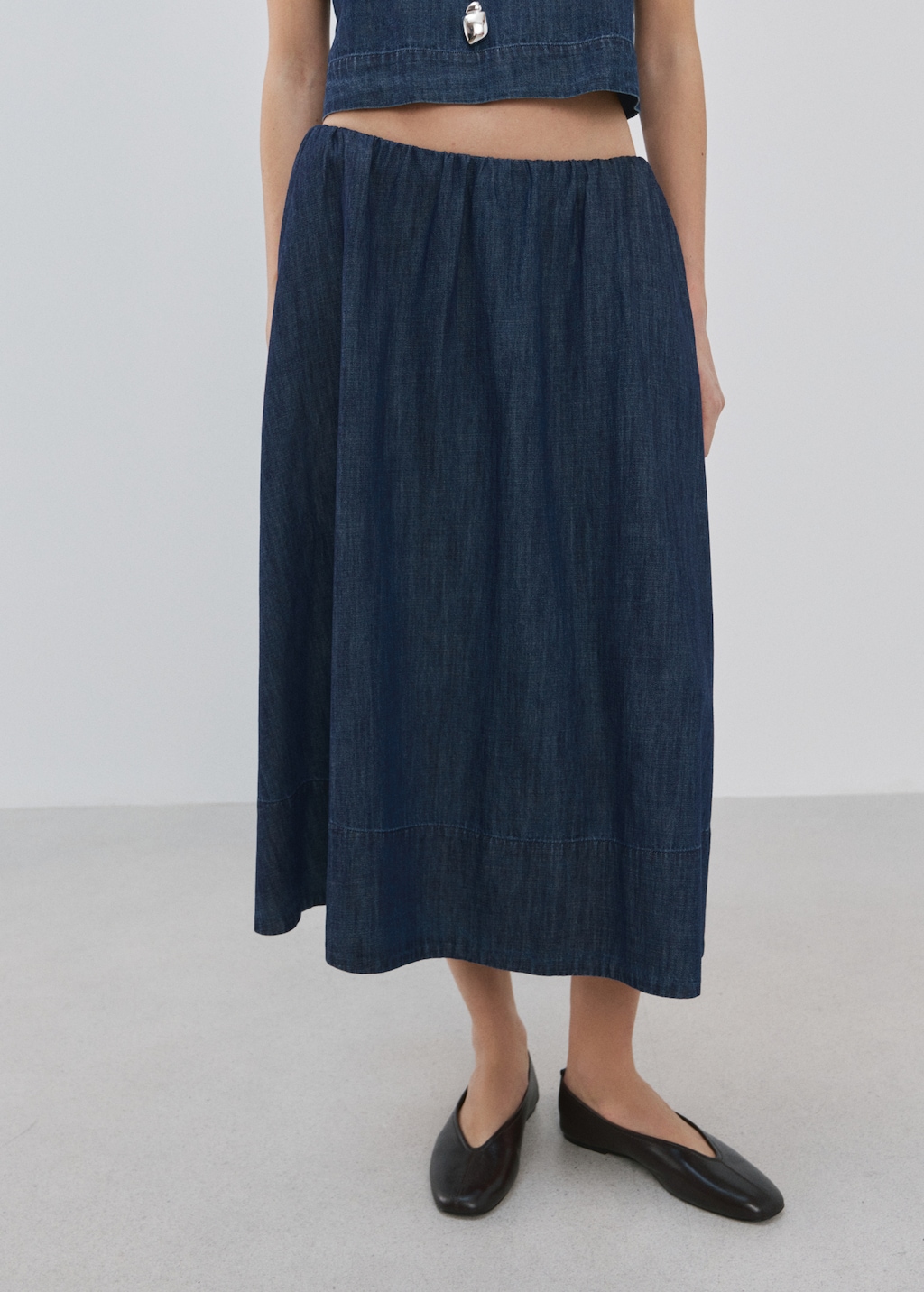 Denim skirt with stitched hem
