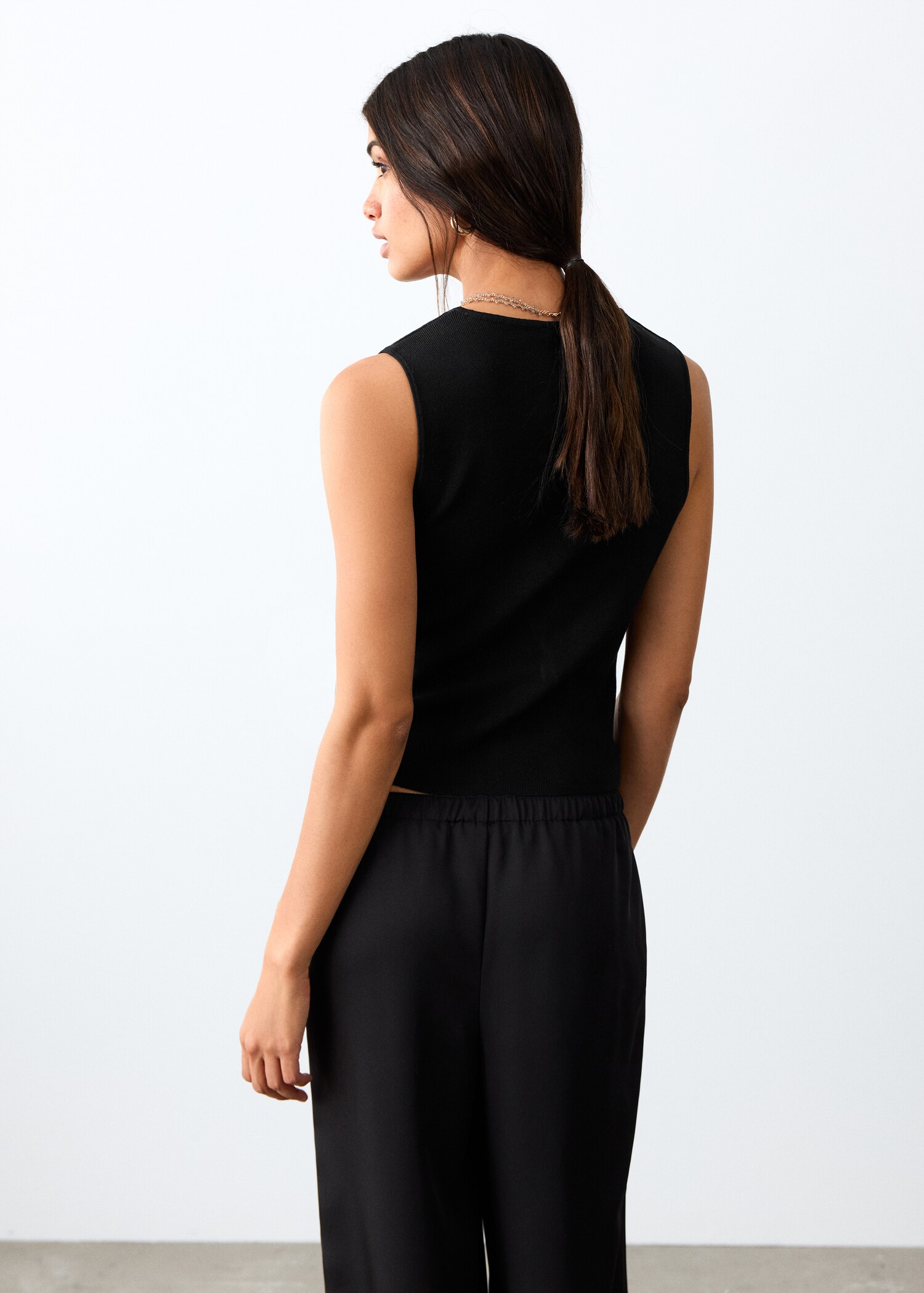 Top cierre lazo - Reverso del artículo