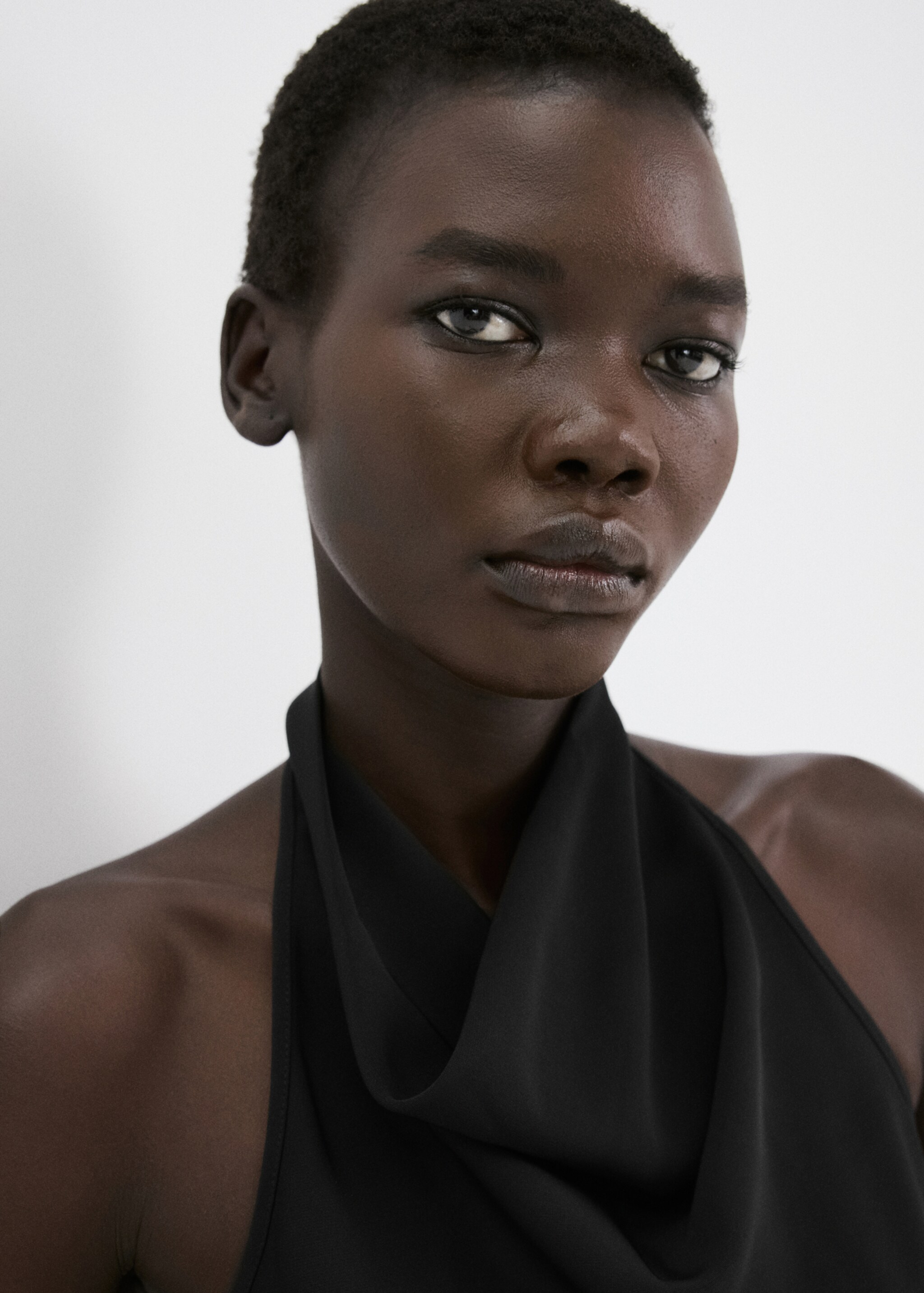 Halter neck jumpsuit with combined detailing - Details of the article 1, Black. Ref: 27085831-00.