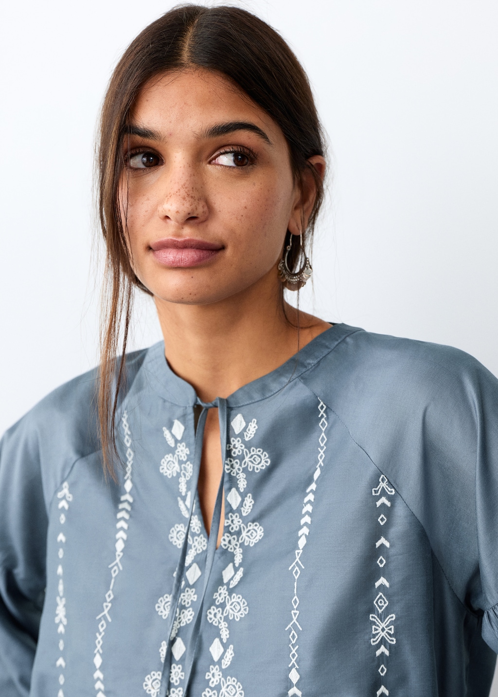Embroidered blouse with bow