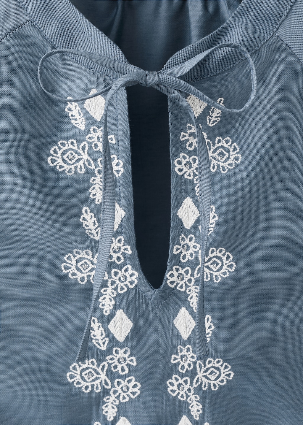 Embroidered blouse with bow