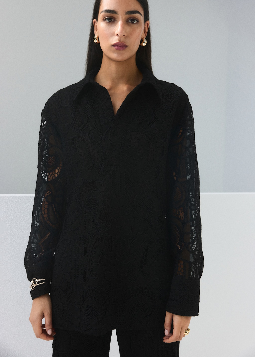 Embroidered blouse with lace accents