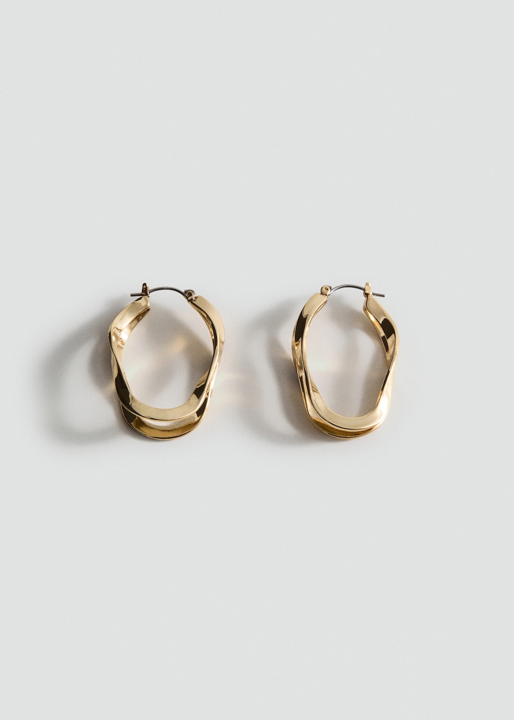 Mango Twisted Hoop Earrings In Gold