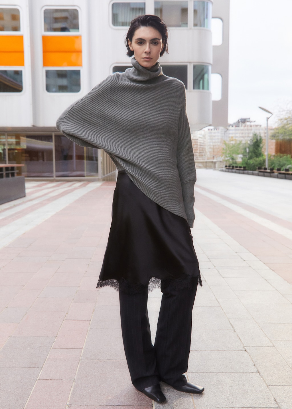 Sweater with asymmetrical roll neck