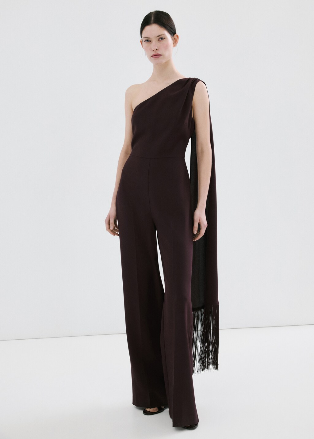 Asymmetrical jumpsuit with fringed scarf