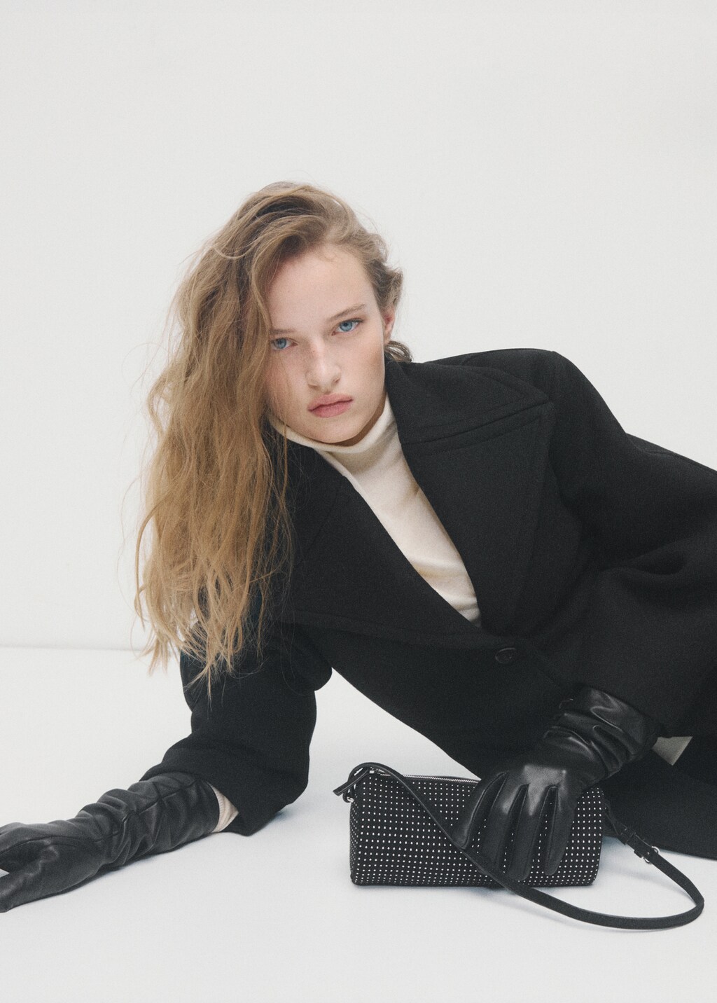 Oval studded shoulder bag