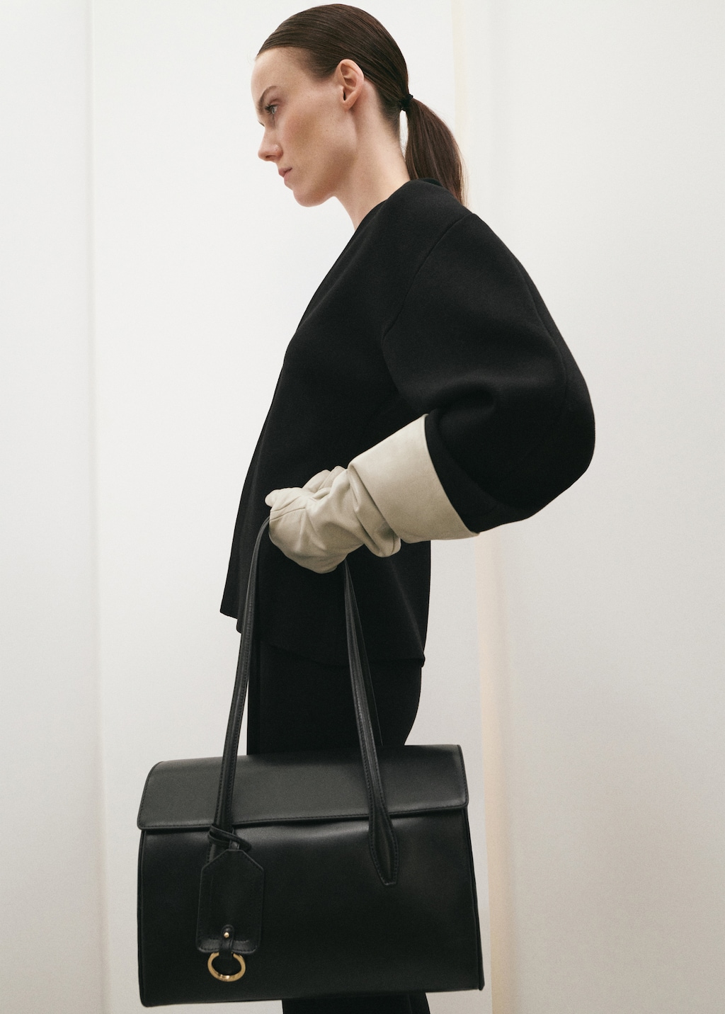 Leather shoulder bag with charms