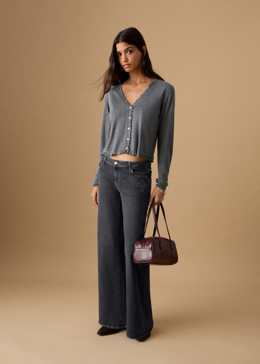 Low-waist studded jeans