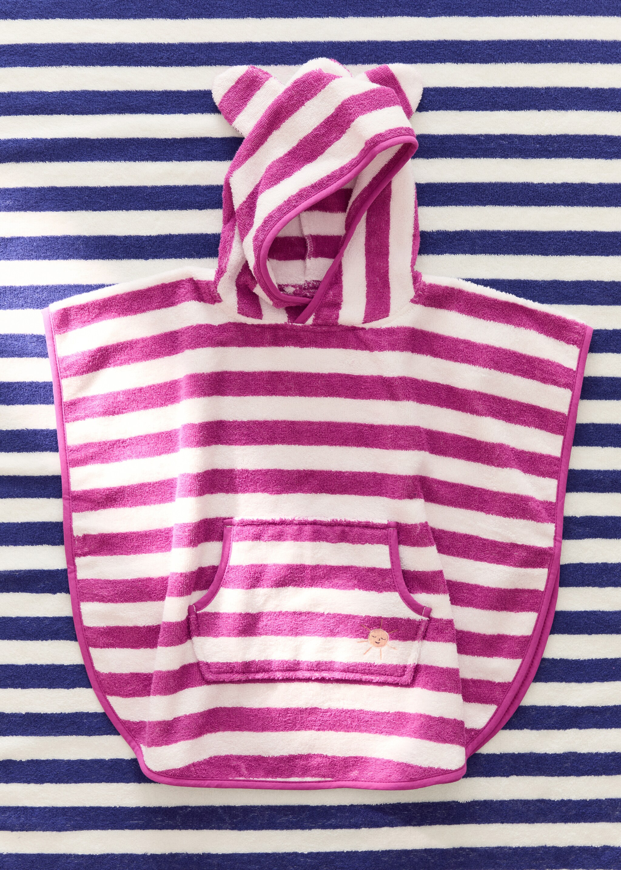 Striped poncho towel - General plane, Fuchsia. Ref: 27072554-00.