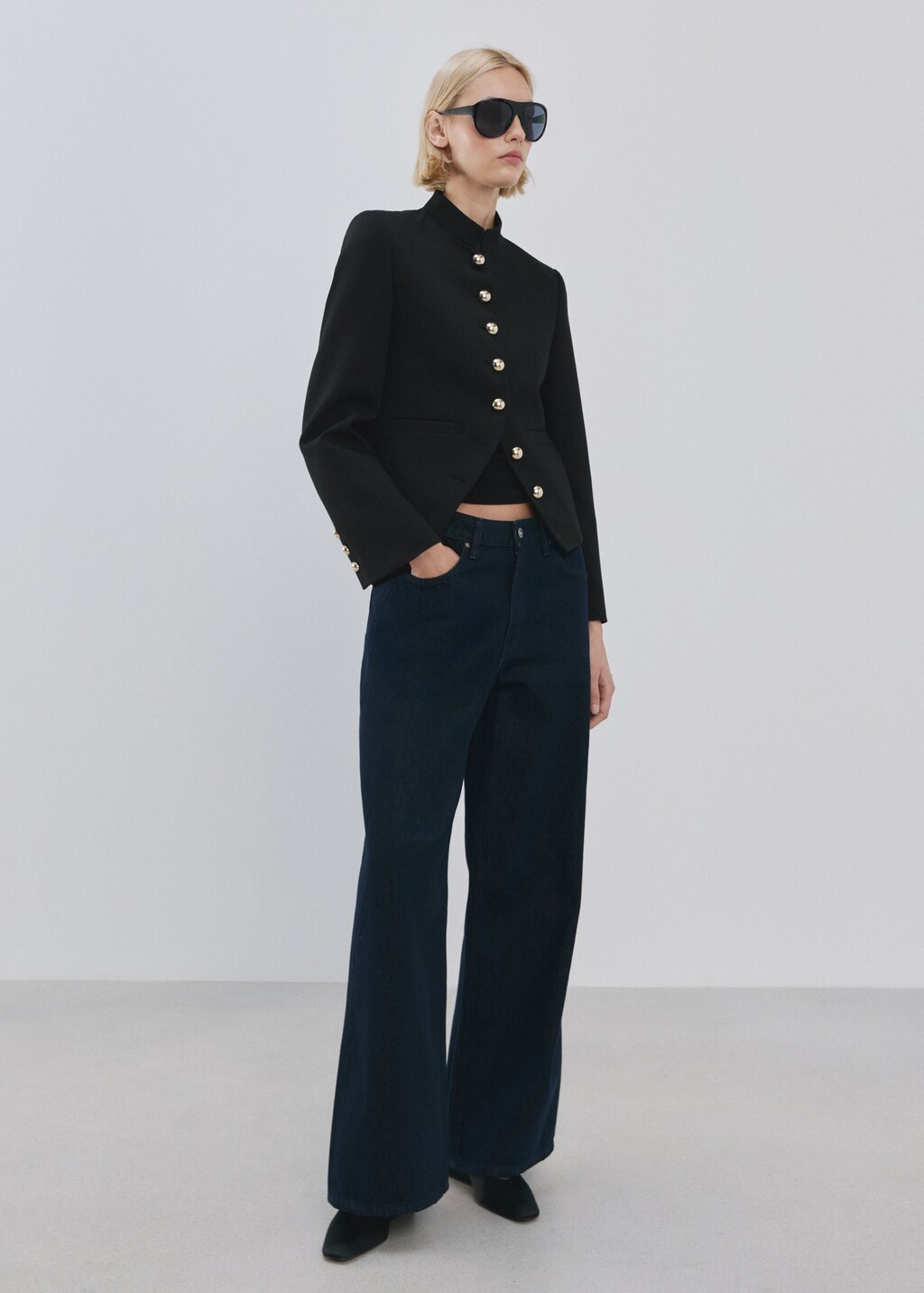 Jacket with jewel-button strip collar