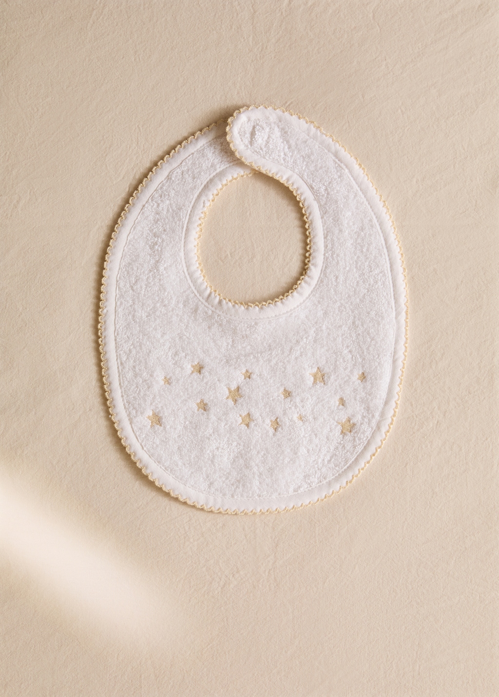 Embroidered cotton bib with stars