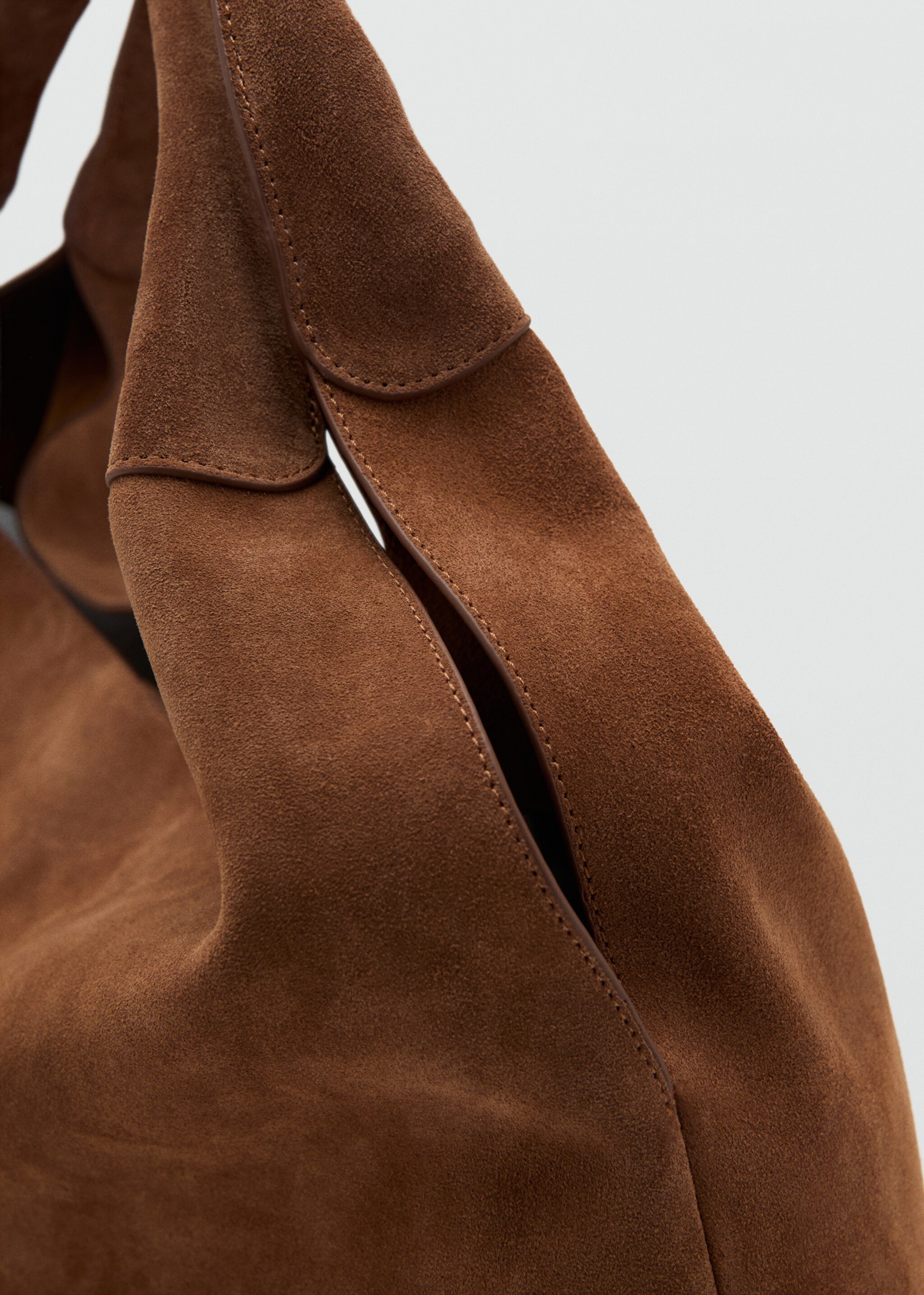 Suede shoulder bag with stitching - Details of the article 2, Brown. Ref: 27034789-02.