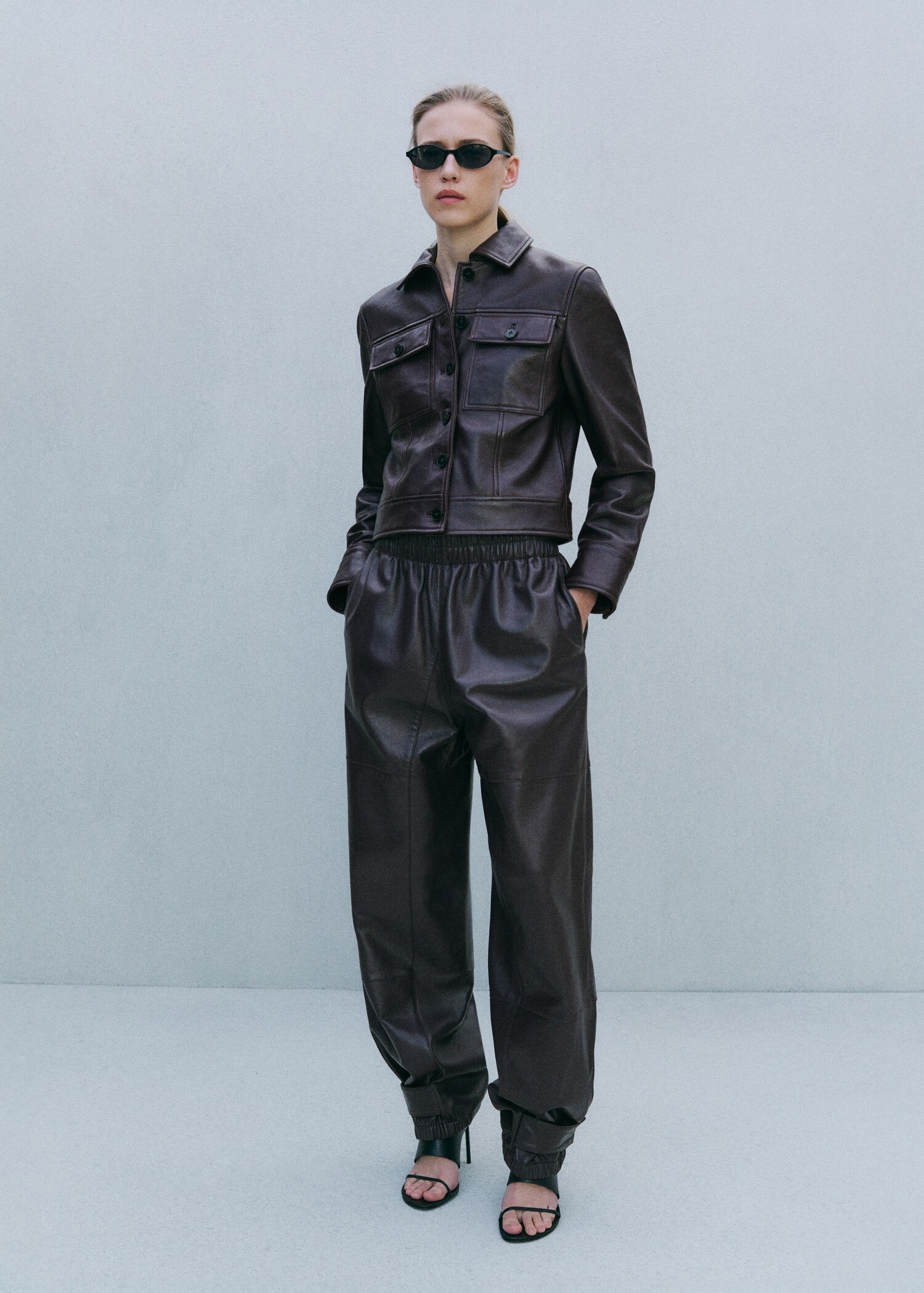 Buttoned hem leather trousers - General plane