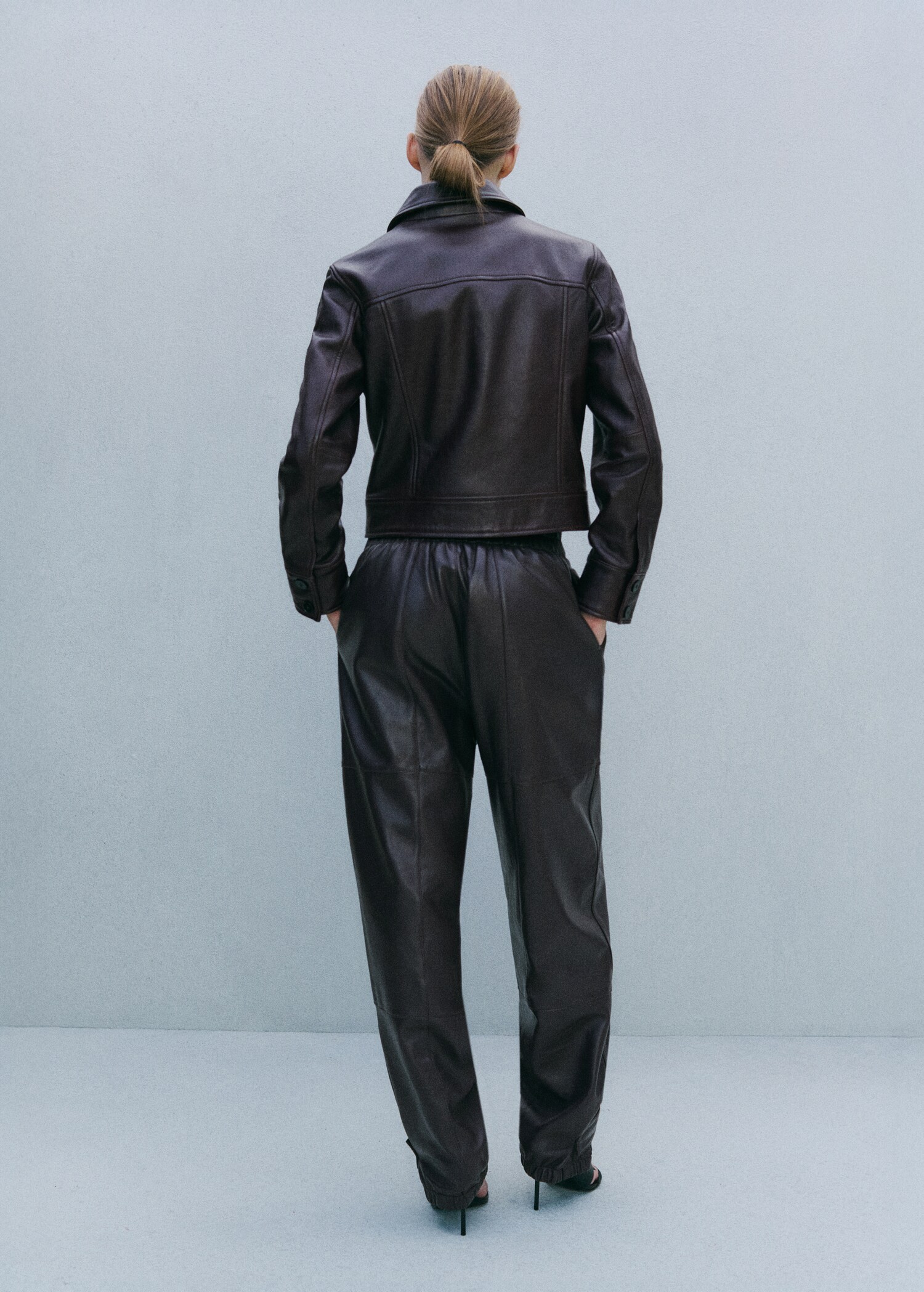 Buttoned hem leather trousers - Reverse of the article