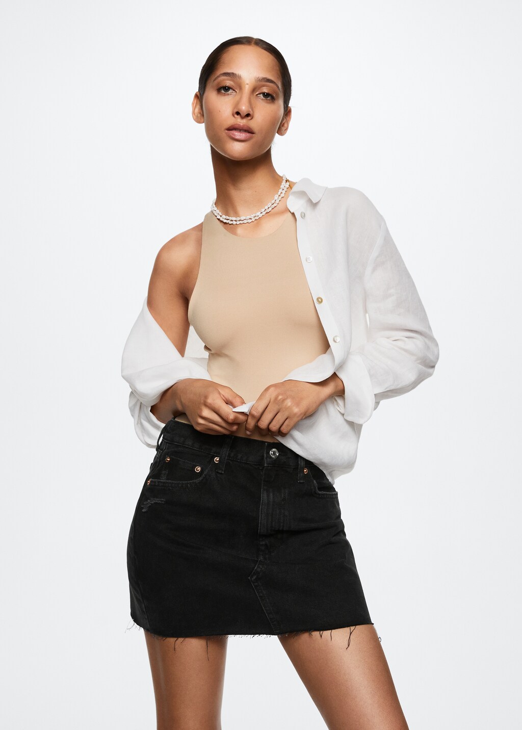 Denim miniskirt with frayed hem