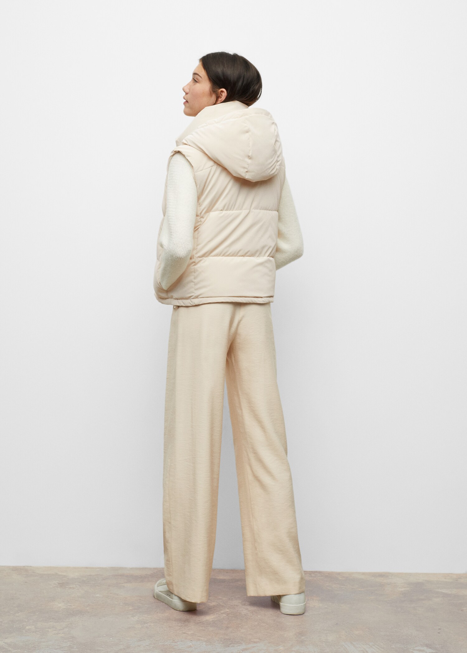 Quilted gilet with hood - Reverse of the article