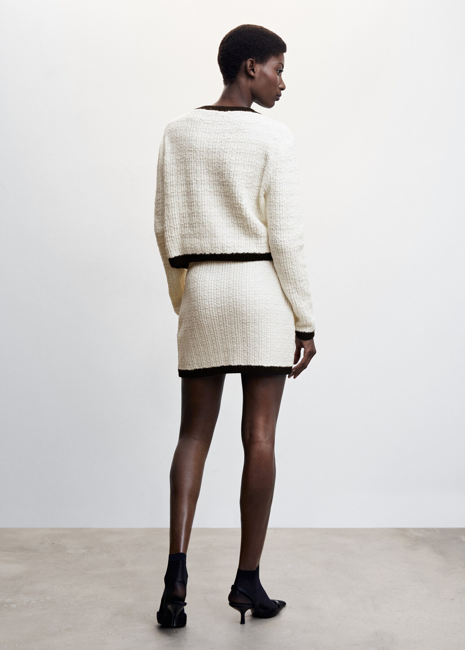 Buttoned tweed skirt - Reverse of the article