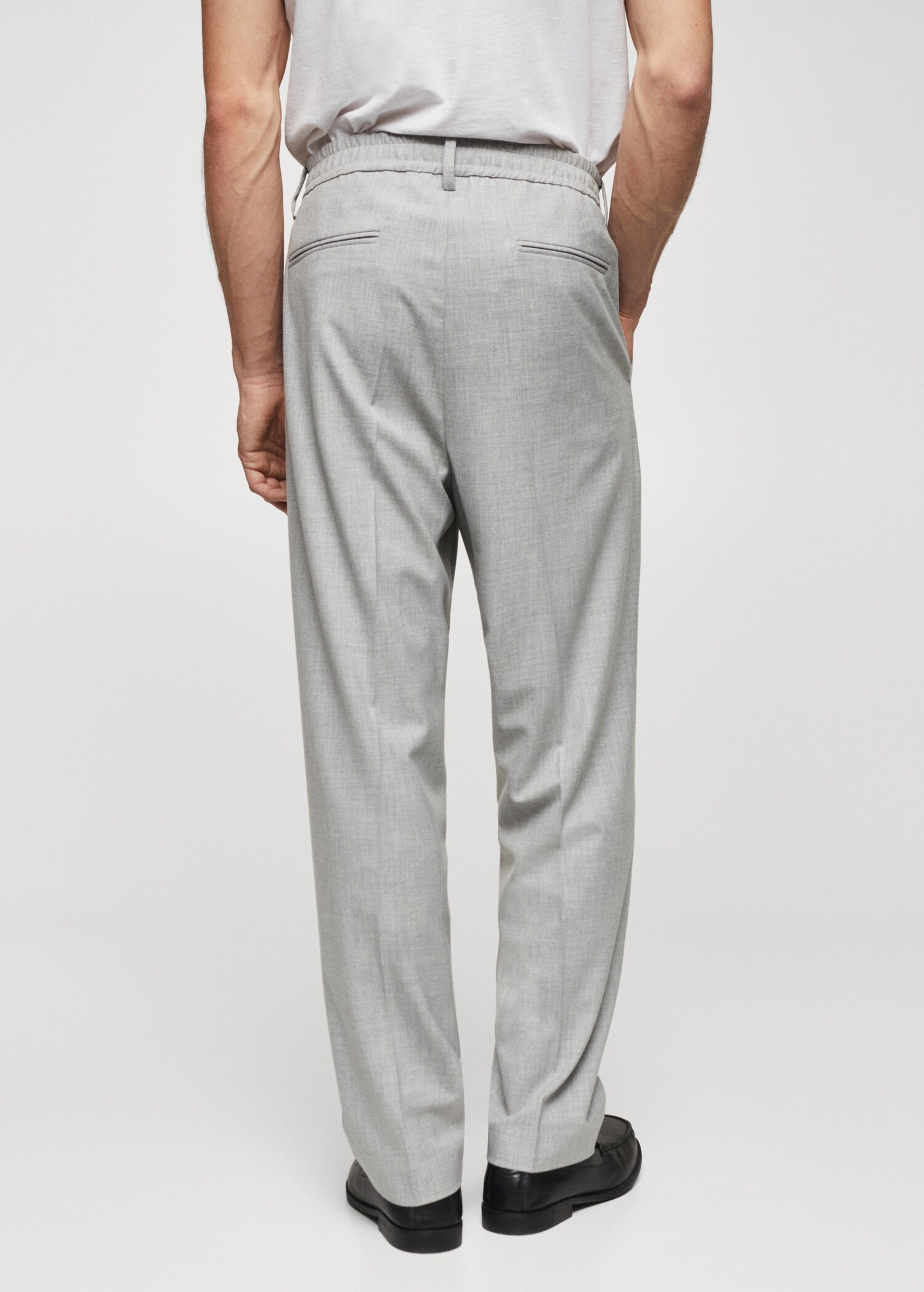 Spodnie tapered fit bawełniane - Tylna strona artykułu