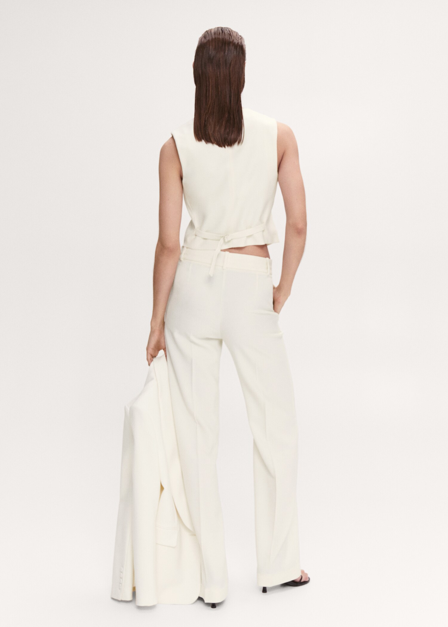 Vest with adjustable belt - Reverse of the article