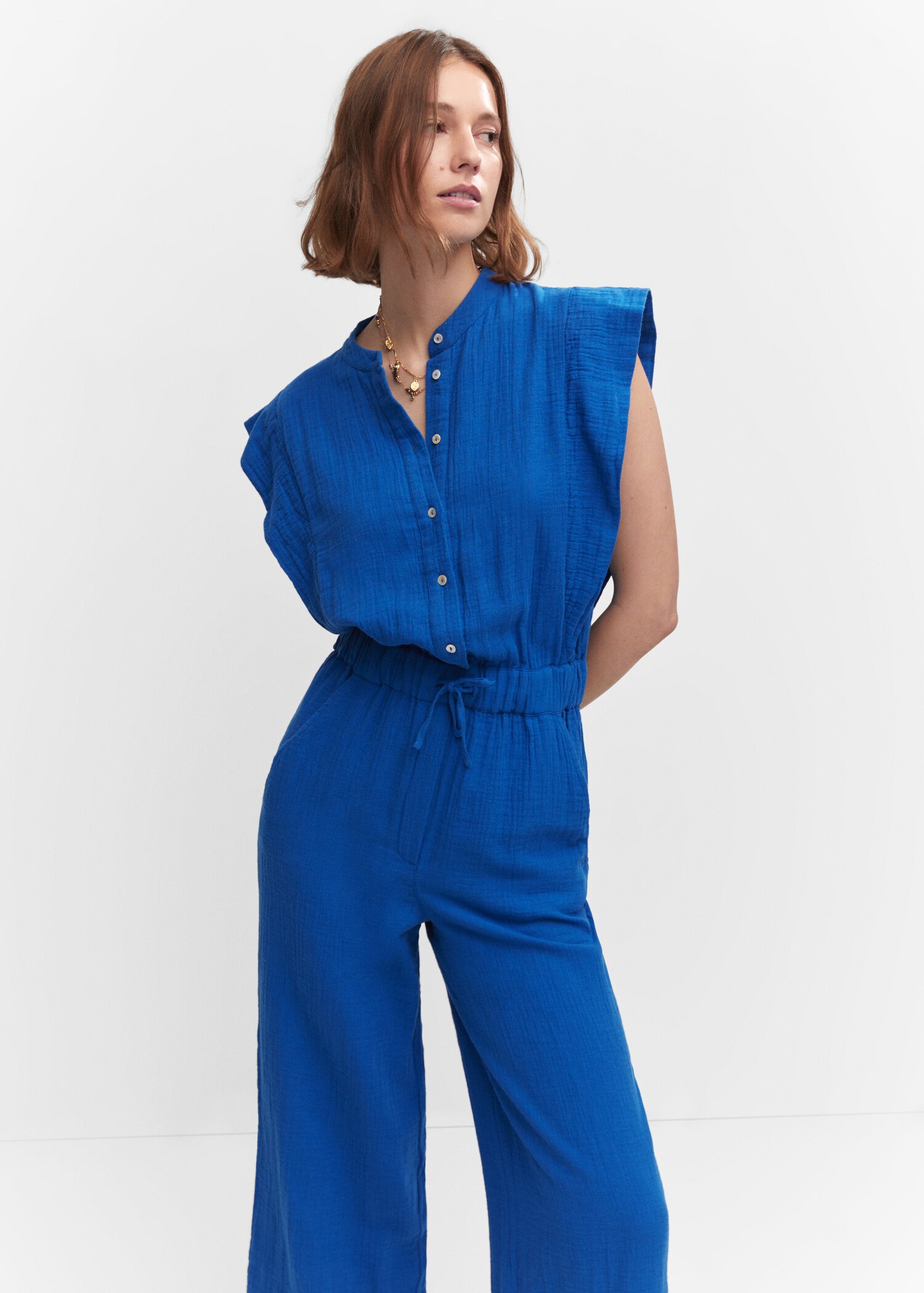 Textured jumpsuit with button - Medium plane