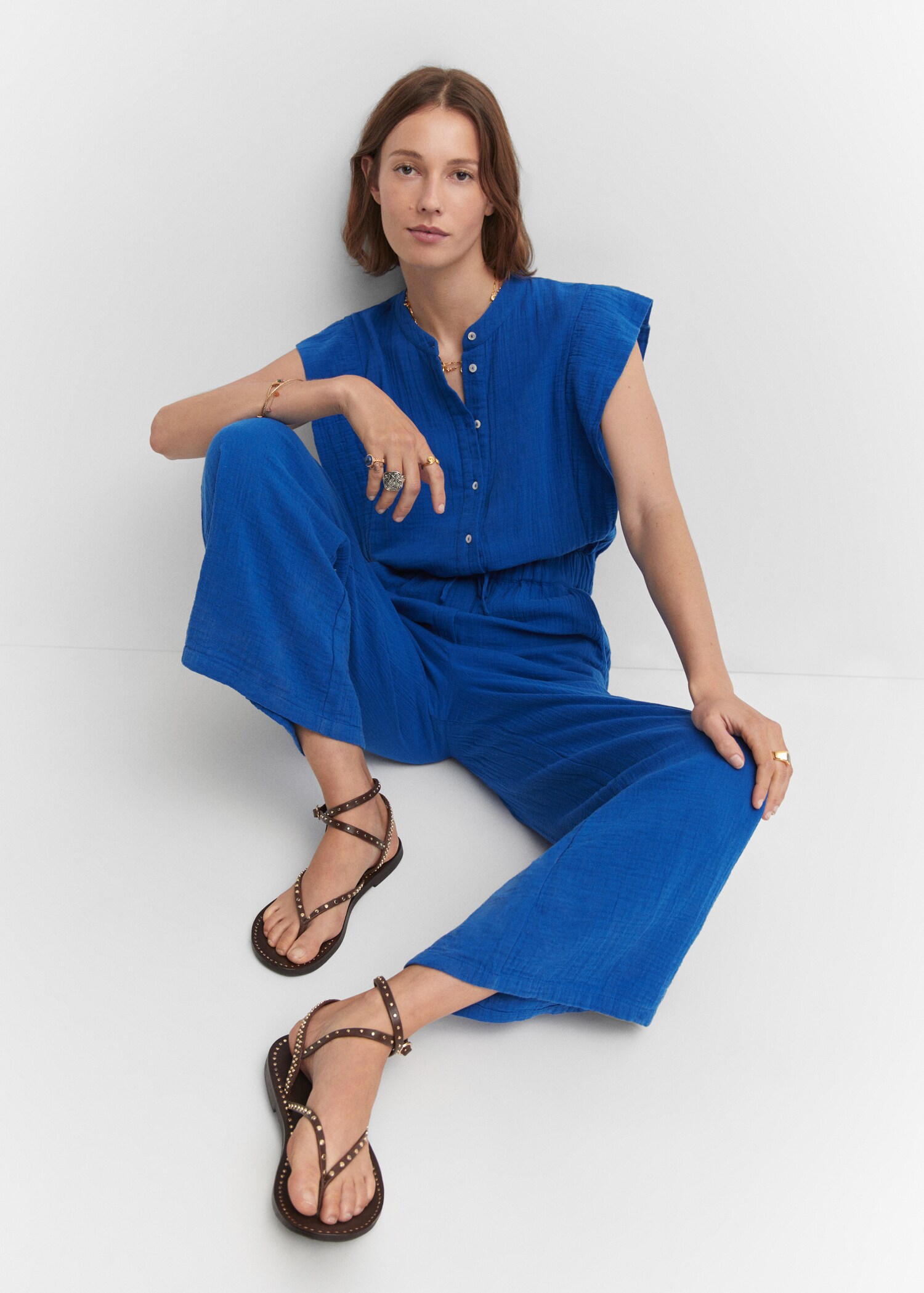 Textured jumpsuit with button - Details of the article 2