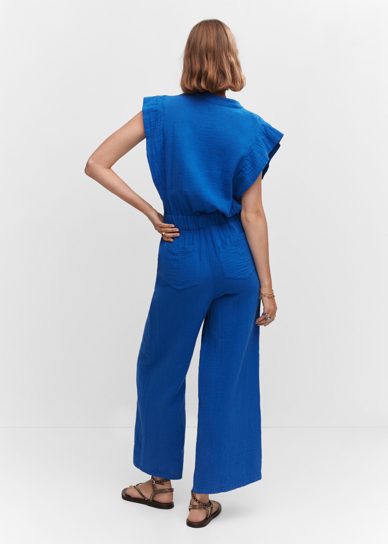 Textured jumpsuit with button - Reverse of the article