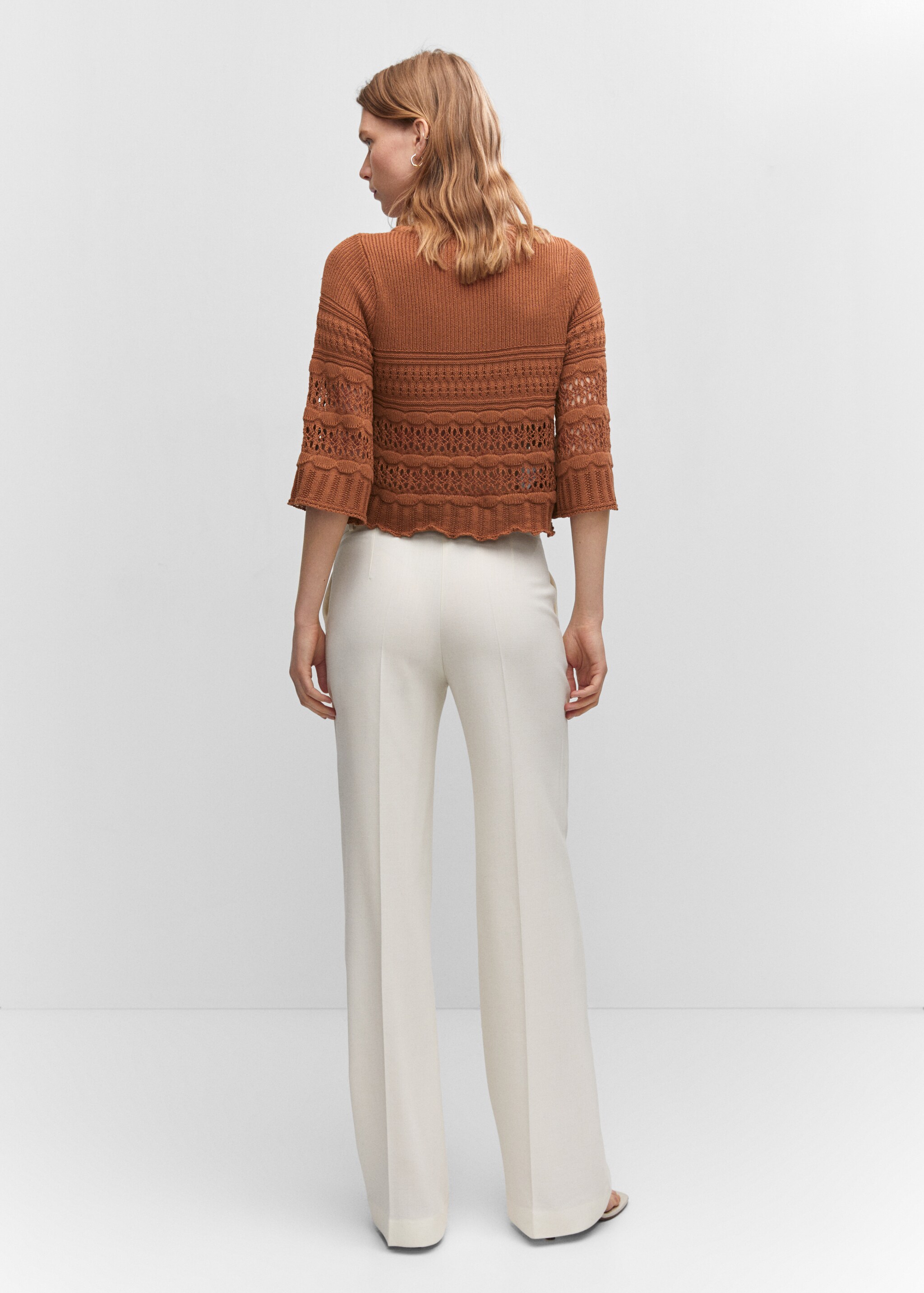 Openwork sweater with flared sleeves - Reverse of the article
