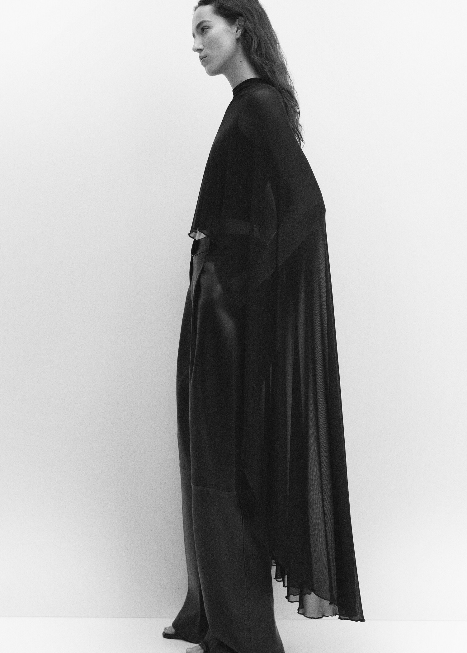 Asymmetric semi-transparent cape - Details of the article 2