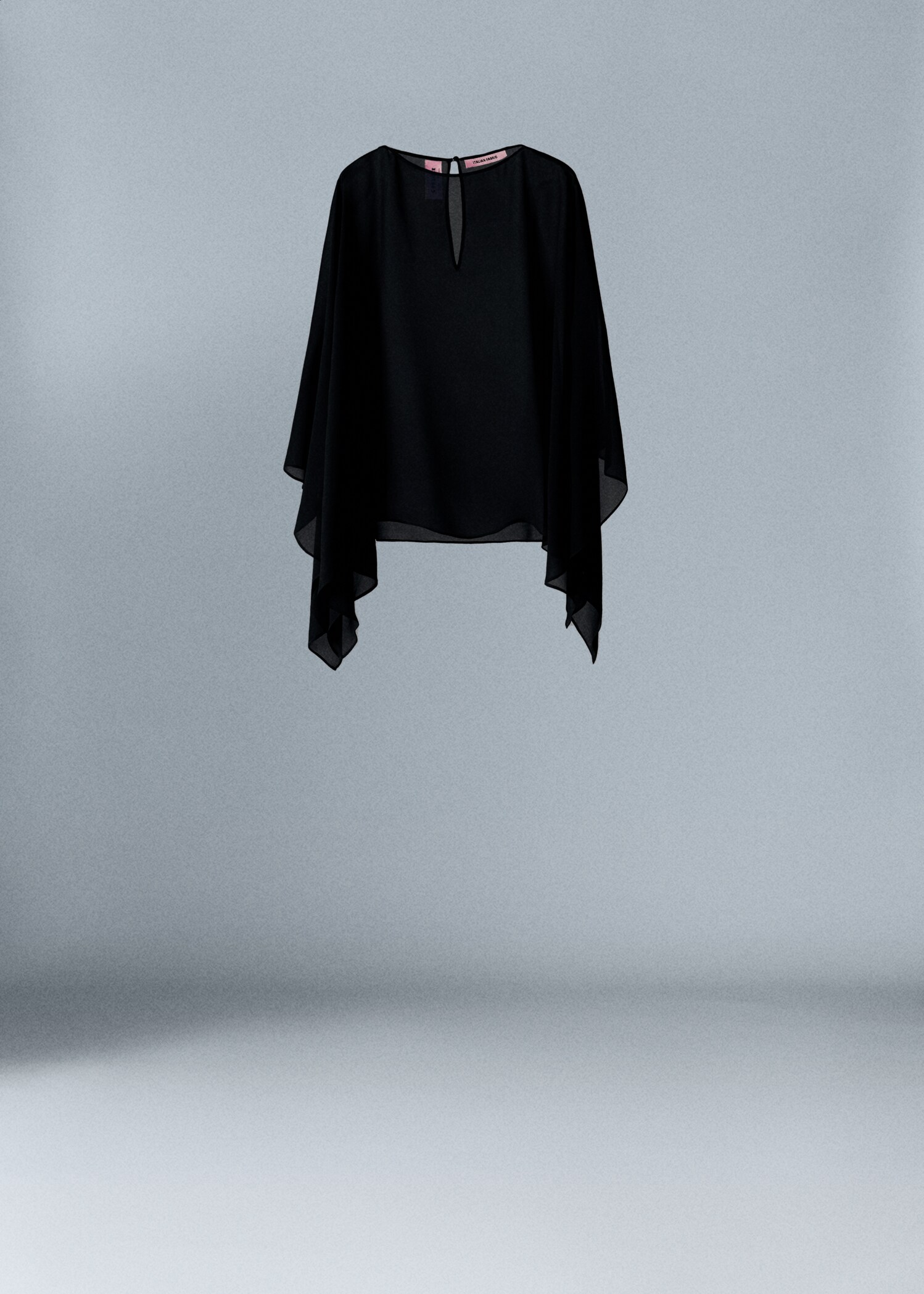 Asymmetric semi-transparent cape - Article without model