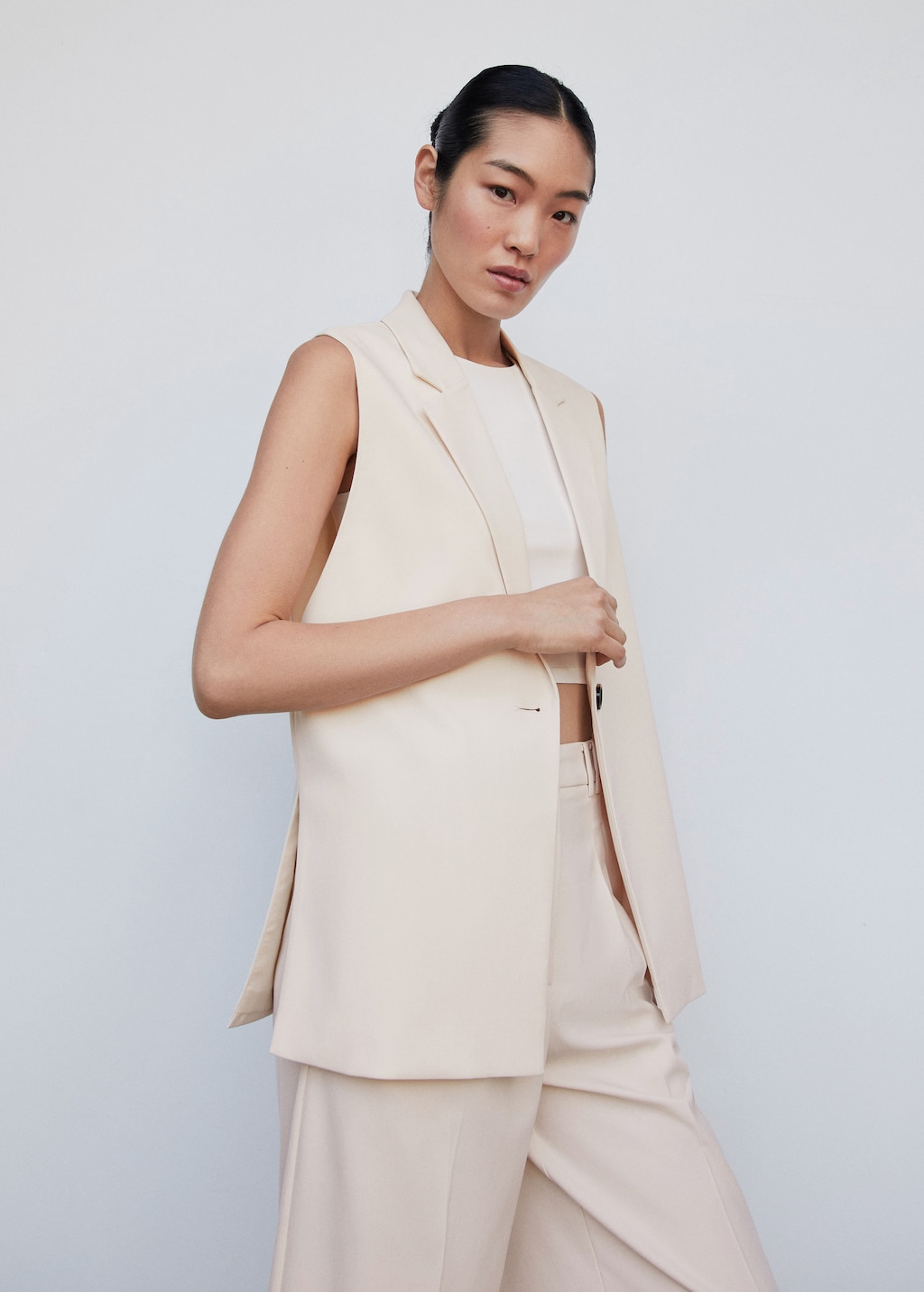 Long gilet with openings