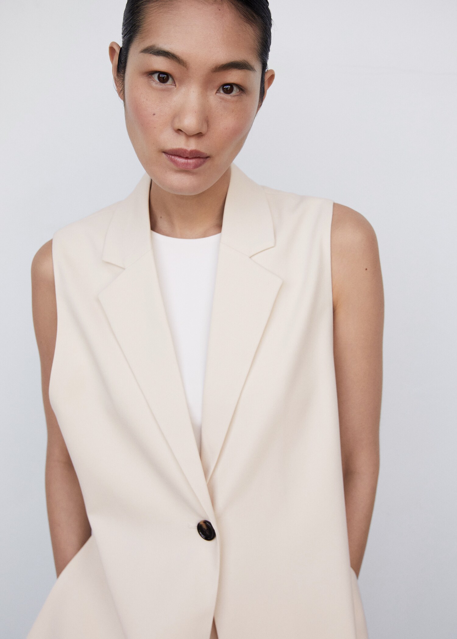 Long gilet with openings - Reverse of the article