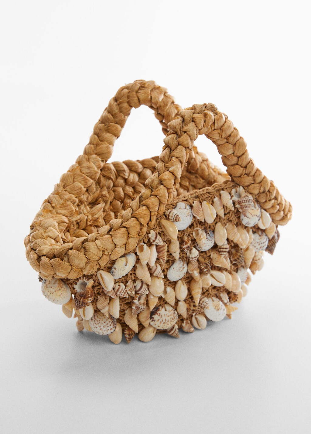 Straw bag shop with shells